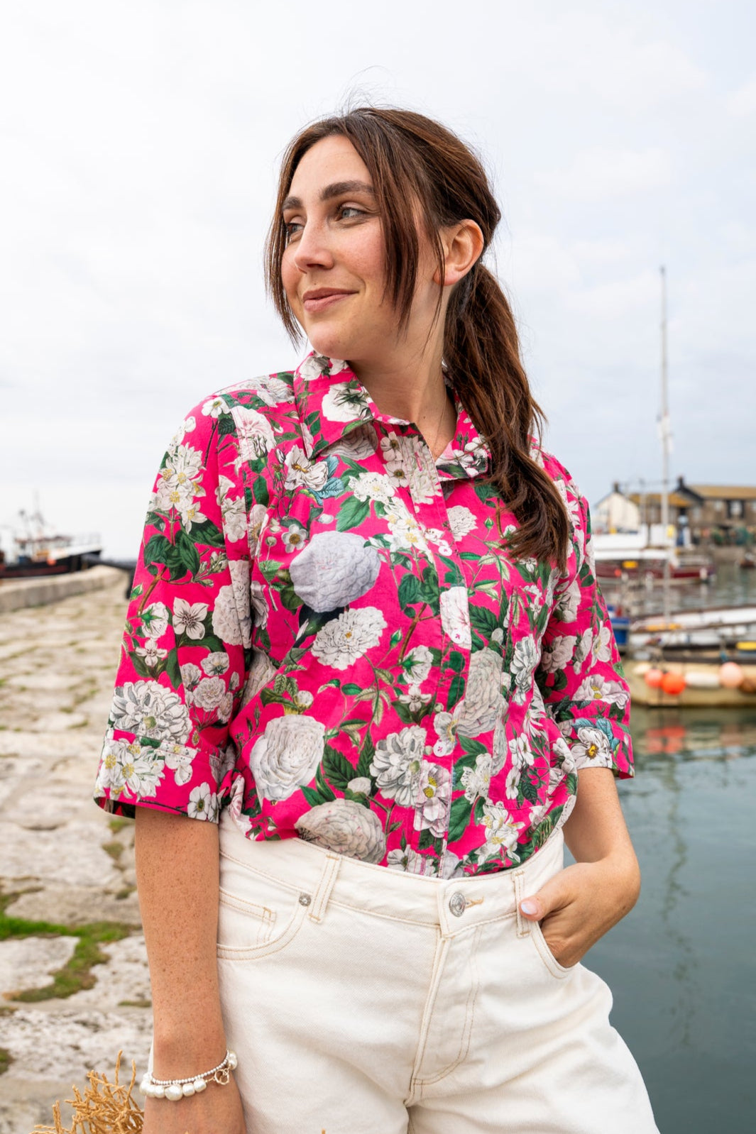 Rosehip Design Abbey cotton shirt has elbow length sleeves with a wide cuff. The hem is curved. Wear it with white jeans, shorts or one of our matching skirts.
Stand out in our vibrant Camelia Magenta design.