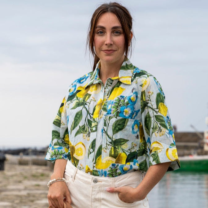 Rosehip Design Abbey cotton shirt has elbow length sleeves with a wide cuff. The hem is curved. Wear it with white jeans, shorts or one of our matching skirts.
Make a statement in our zesty Sicily design.