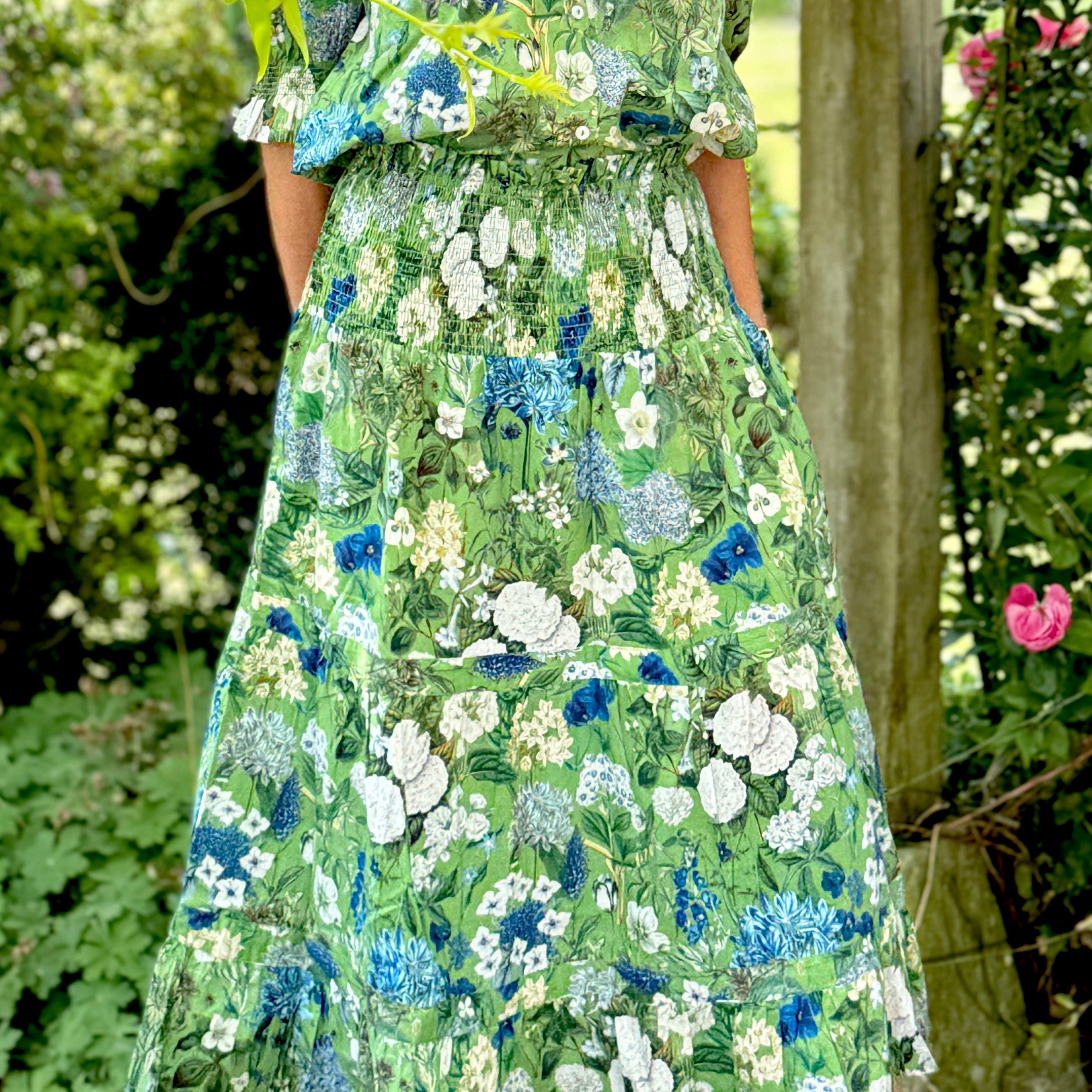 Rosehip Design Bella Cotton Skirt in our Spring Greens design is a beautifully feminine, effortlessly comfortable piece, perfect for Summer. Made from soft, breathable cotton with a flattering, flexible shirred waistband. The tiered design adds movement and a touch of romantic charm, while the addition of practical pockets makes it as functional as it is stylish.
Whether paired with a simple tee or the coordinating Hannah Shirt, it&