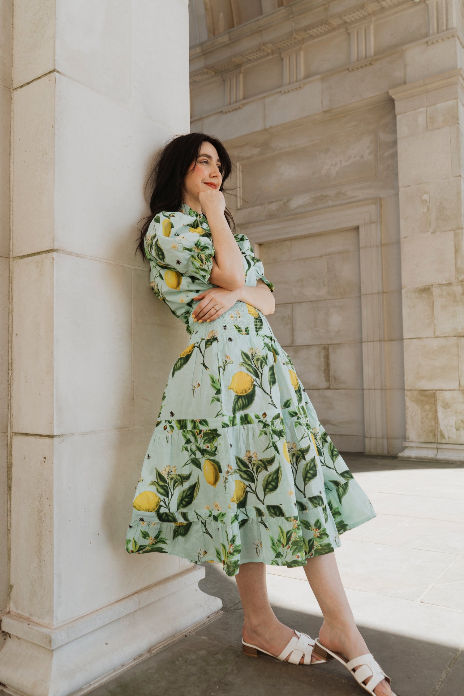The Rosehip Design Hannah Cotton Shirt in Citrus Blue is a timeless blend of elegance and comfort. Made from soft cotton, it features a delicate frilled collar and intricate smocking on the sleeves for a touch of vintage charm. Designed for effortless styling, it pairs beautifully with the Bella Skirt