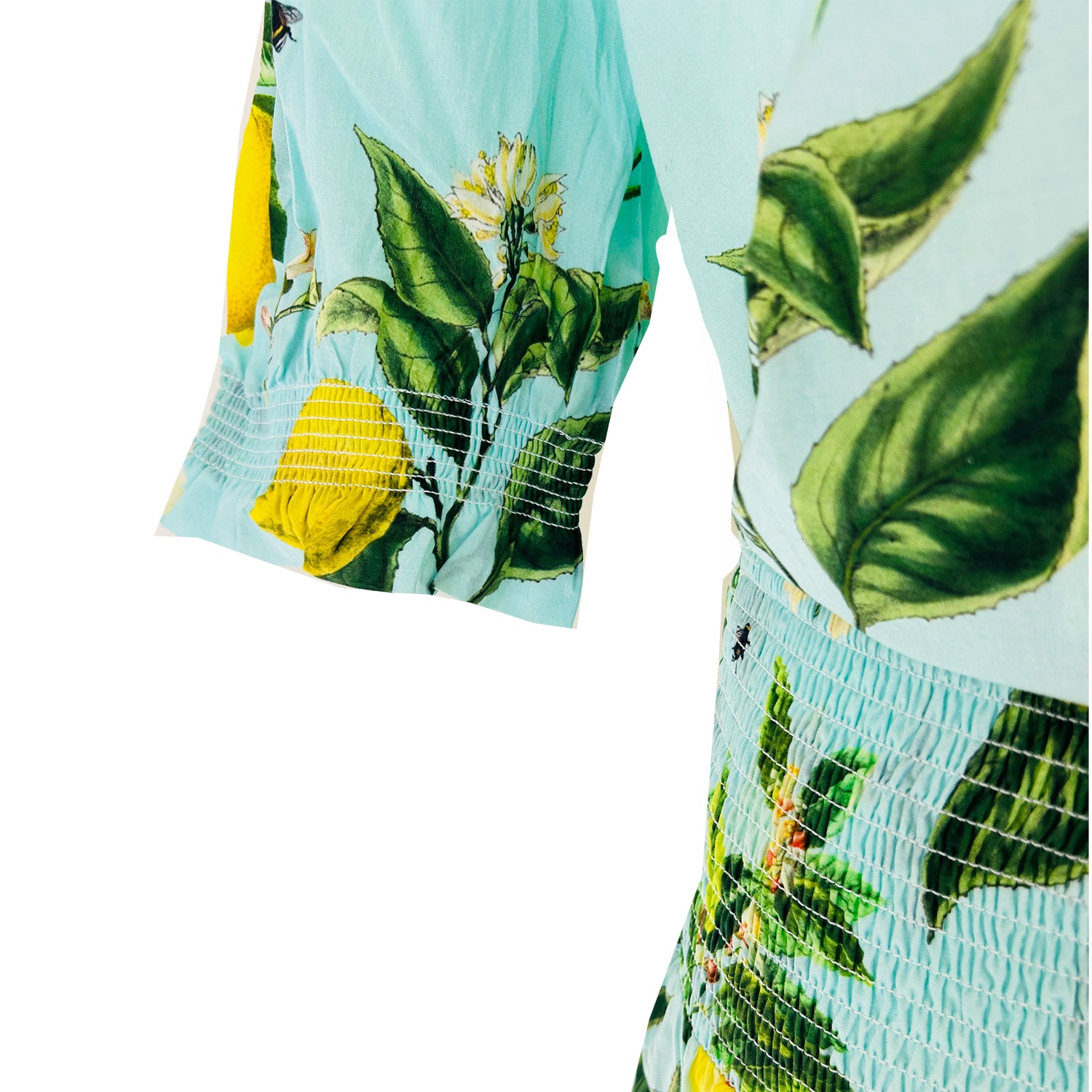 Rosehip Designs Hannah Cotton Shirt in Citrus Blue is a timeless blend of elegance and comfort. Made from soft cotton, it features a delicate frilled collar and intricate smocking on the sleeves for a touch of vintage charm. Designed for effortless styling, it pairs beautifully with the Bella Skirt.