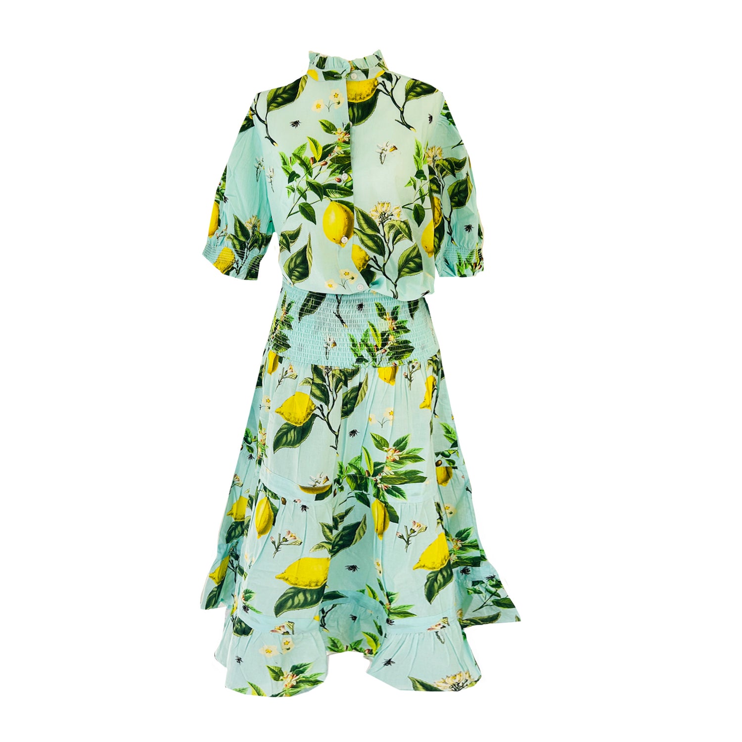 Rosehip Designs Hannah Cotton Shirt in Citrus Blue is a timeless blend of elegance and comfort. Made from soft cotton, it features a delicate frilled collar and intricate smocking on the sleeves for a touch of vintage charm. Designed for effortless styling, it pairs beautifully with the Bella Skirt.