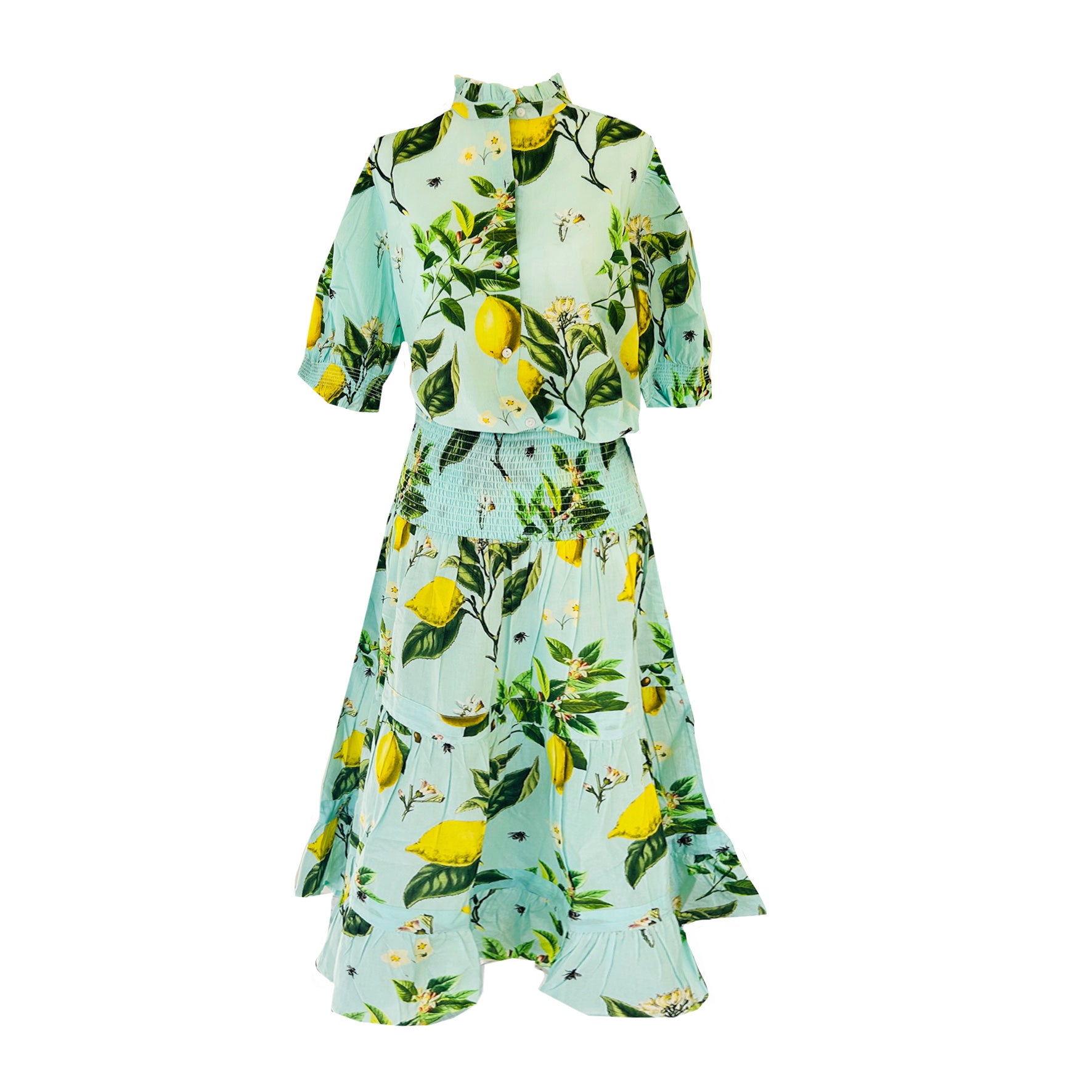 Rosehip Designs Hannah Cotton Shirt in Citrus Blue is a timeless blend of elegance and comfort. Made from soft cotton, it features a delicate frilled collar and intricate smocking on the sleeves for a touch of vintage charm. Designed for effortless styling, it pairs beautifully with the Bella Skirt.