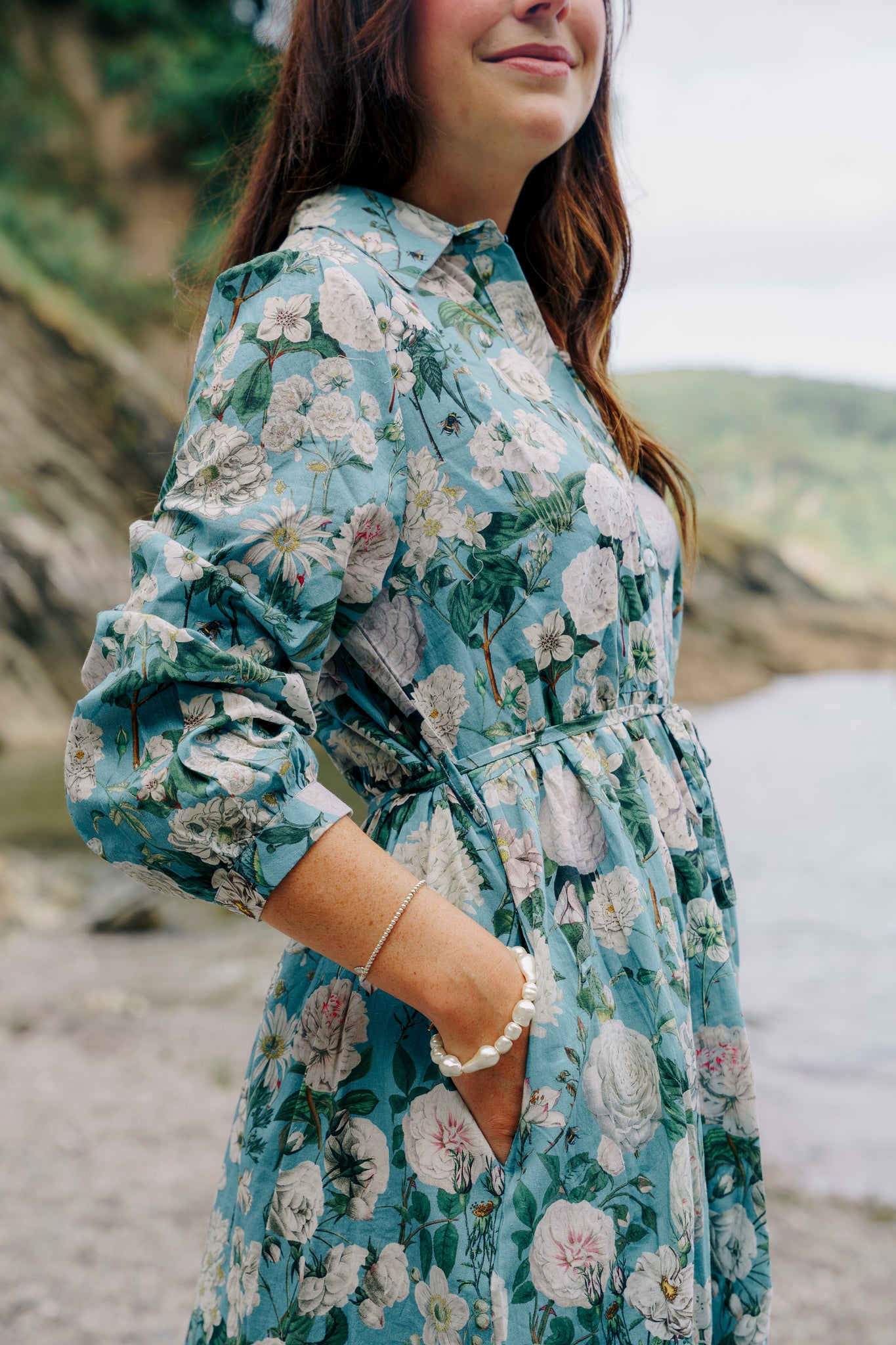 Rosehip Design Josie Cotton Dress is a knee-length cotton tiered dress with a tie belt and pockets.
Make a glamorous entrance in our breezy Camelia Ocean design.