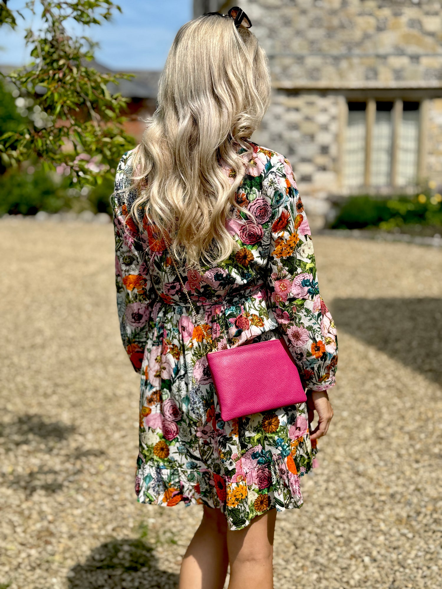Rosehip Design Josie Cotton Dress is a knee-length cotton tiered dress with a tie belt and pockets. 
Stand out in our colourful Fiesta design.
