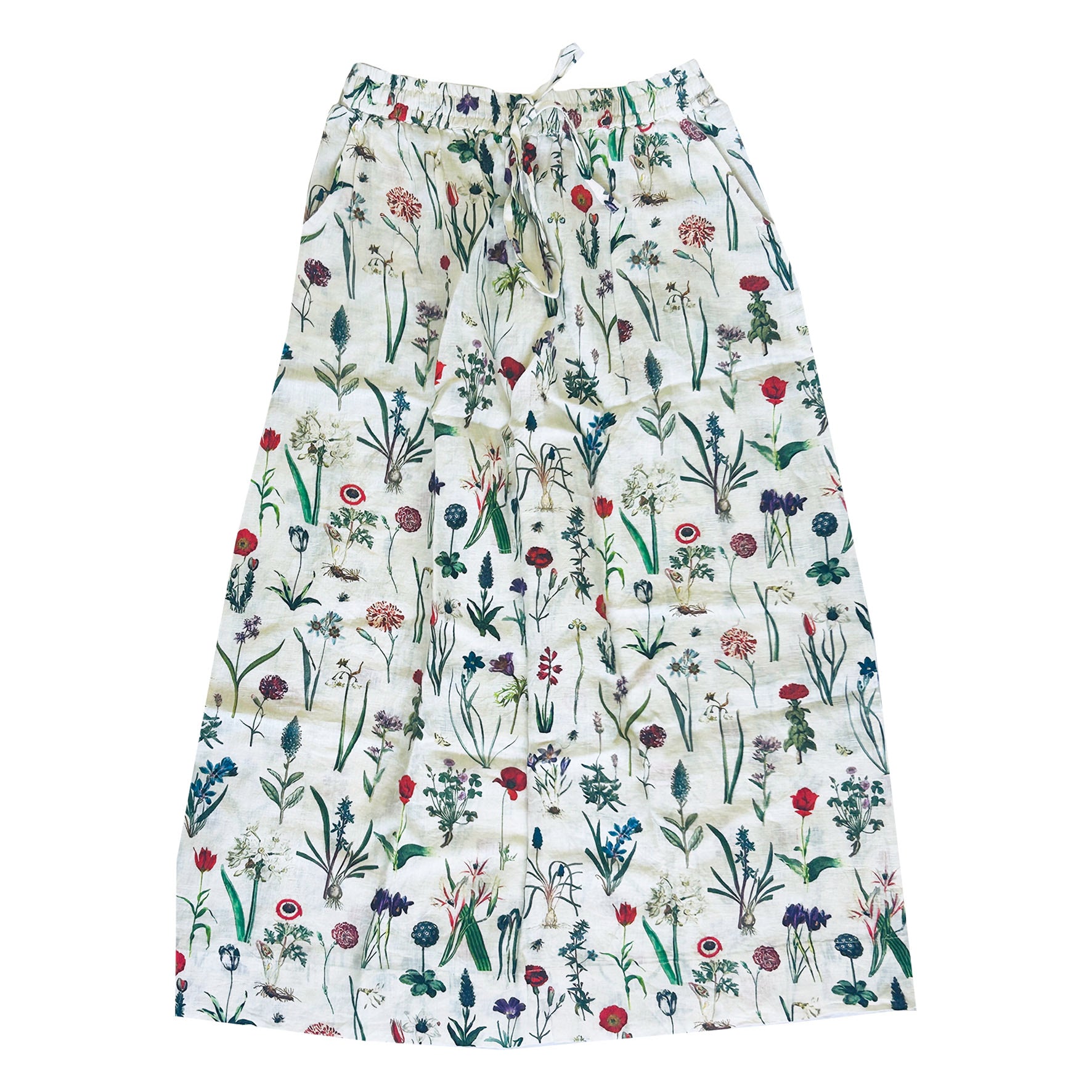Crafted from 100% linen, the Lilah Skirt in April design is a warm-weather staple with timeless appeal. Designed with a flattering classic cut, it features an elasticated waistband with a functional drawstring for a comfortable, adjustable fit. Subtle side slits add ease of movement and a touch of effortless elegance — perfect for sunny days, from morning markets to seaside strolls.