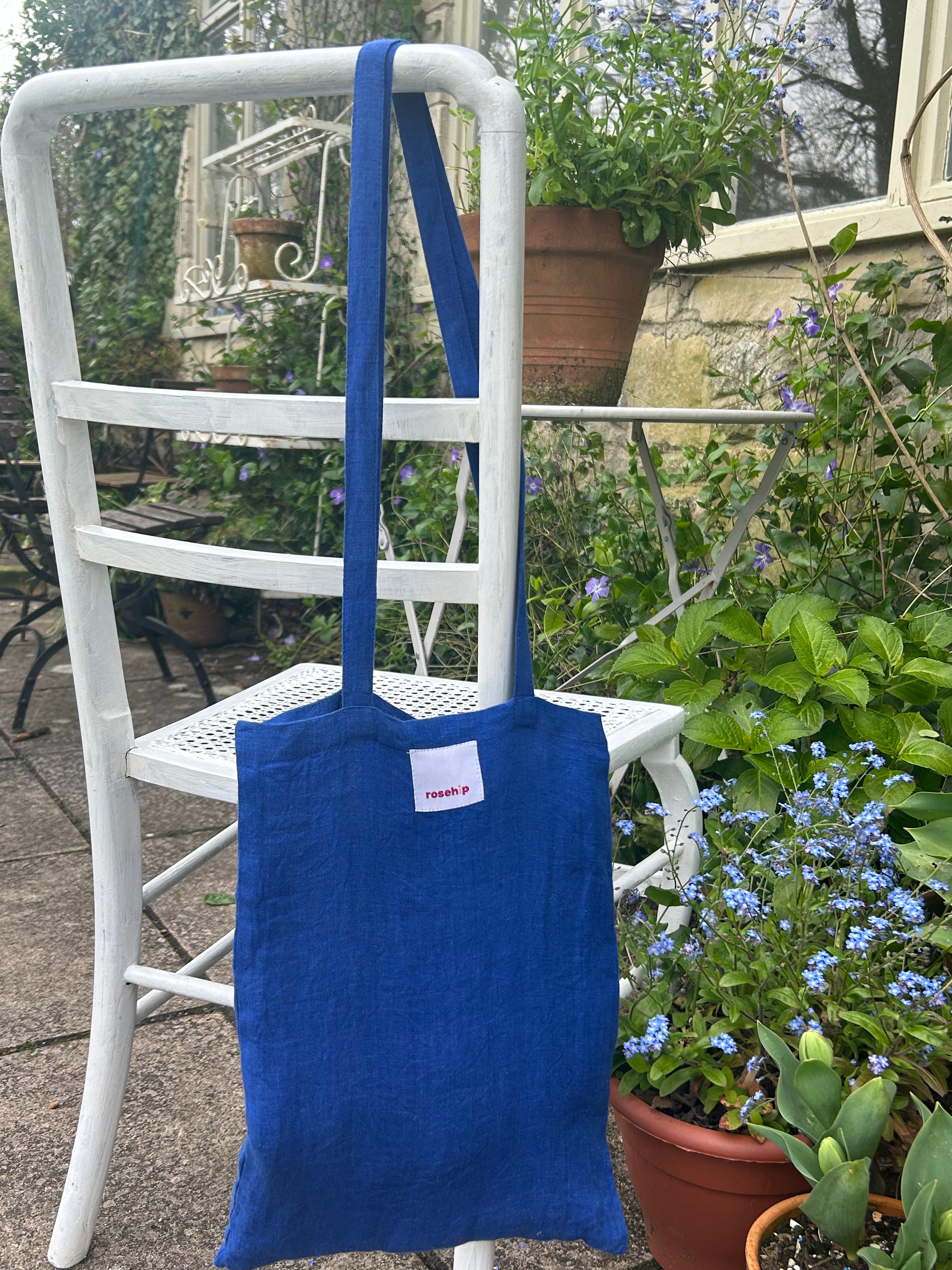Rosehip Design Lucy Dress is a classic Shirt dress with 3/4 length sleeves, side pockets, front buttons and curved side slits. Made from 100% Linen in brilliant blue Sapphire.