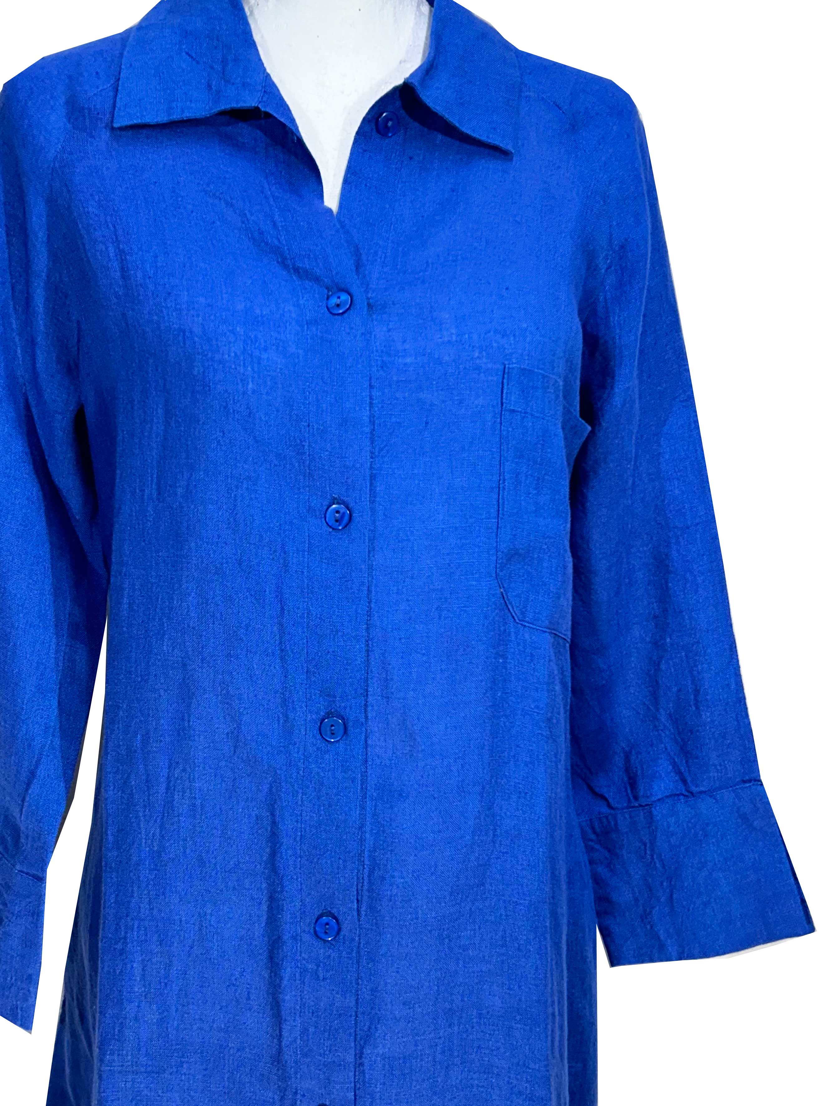 Rosehip Design Lucy Dress is a classic Shirt dress with 3/4 length sleeves, side pockets, front buttons and curved side slits. Made from 100% Linen in brilliant blue Sapphire.