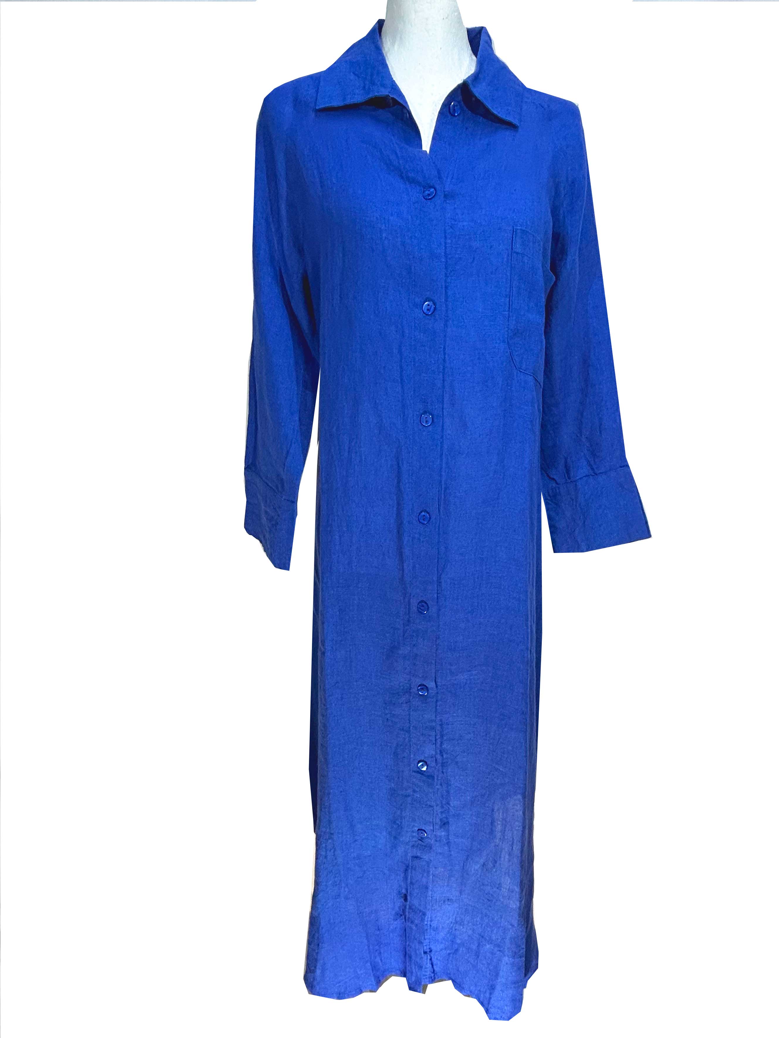 Rosehip Design Lucy Dress is a classic Shirt dress with 3/4 length sleeves, side pockets, front buttons and curved side slits. Made from 100% Linen in brilliant blue Sapphire.