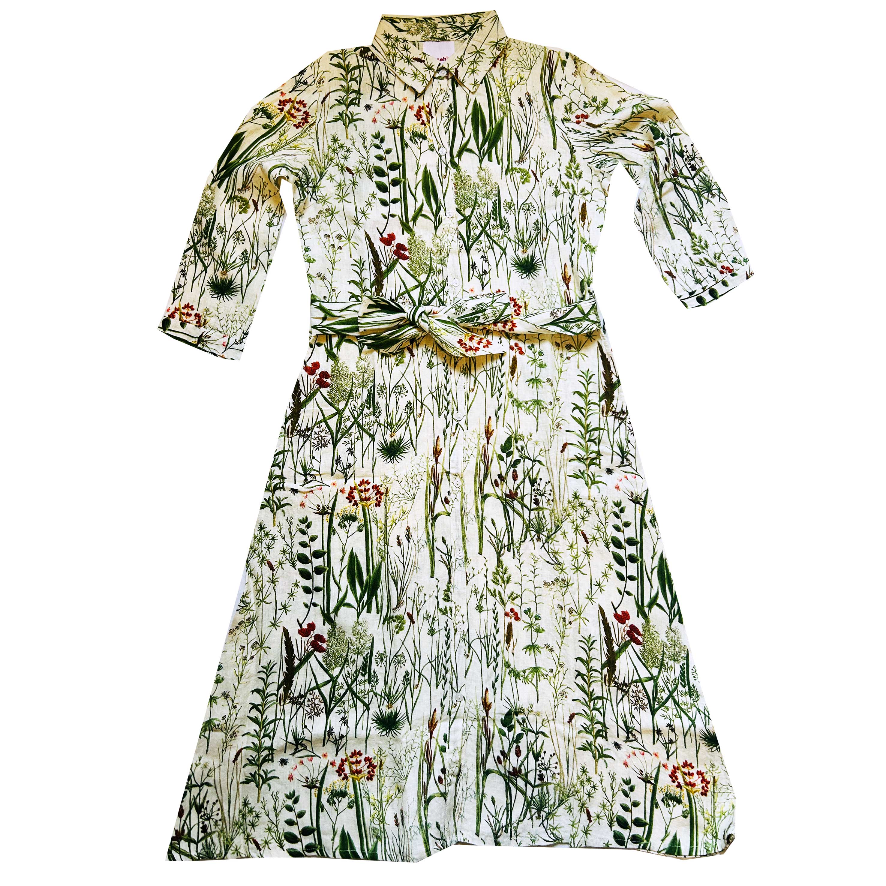Spring into style with the Rosehip Design Lydia Linen Dress in Wildgrass design. This shirtwaister dress features a beautiful floral design and a fabric tie belt for a flattering fit. With its long sleeves and button-up front, this dress is the perfect combination of comfort and chic. Ready to bloom in your wardrobe!