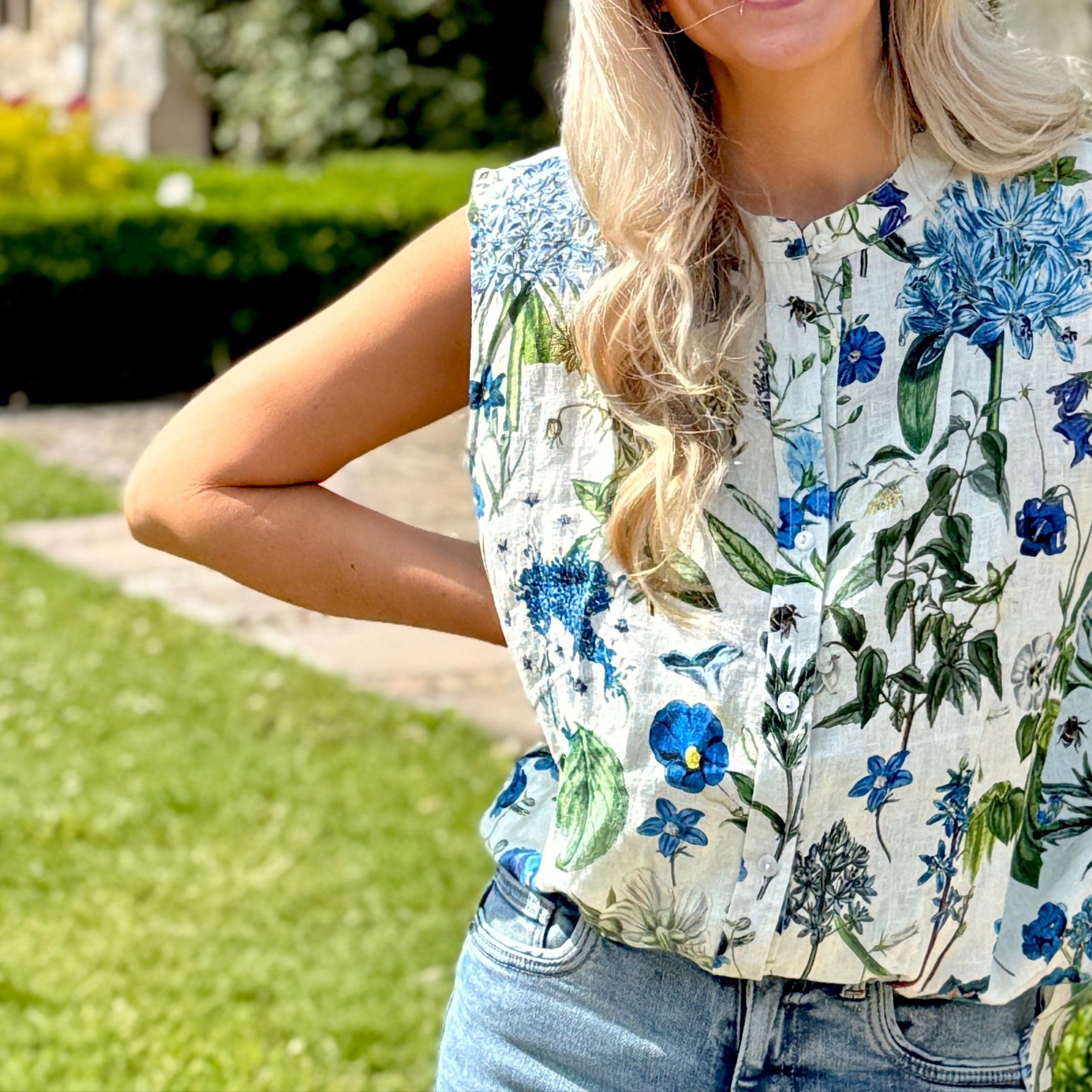 The Maeve is a fabulous sleeveless Linen shirt with buttons down the front and a beautifully curved hem. Available in Rosehip Designs signature floral fabrics.
The Maeve shirt looks lovely with shorts or jeans, or can be worn with the matching Lilah Linen skirt