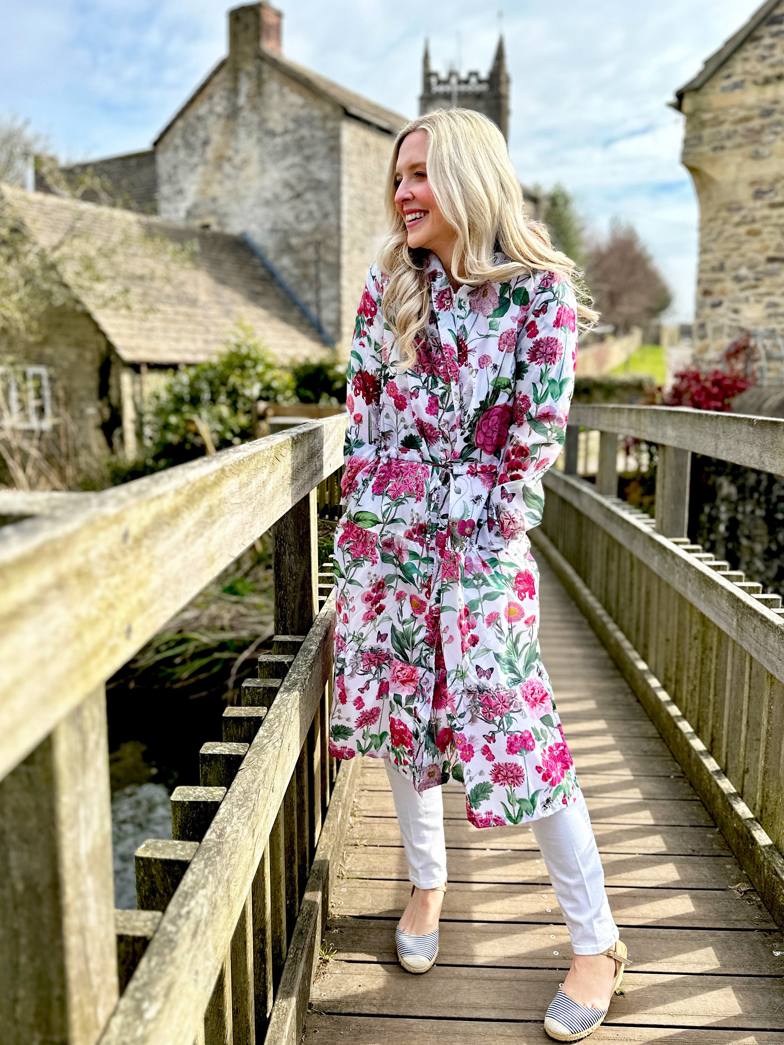 Beautiful light-weight calf length summer parka from Rosehip Design in our vibrant Sweetpeas design. The Windsor Parka has a long tiered skirt, drawstring waist and fully lined hood.