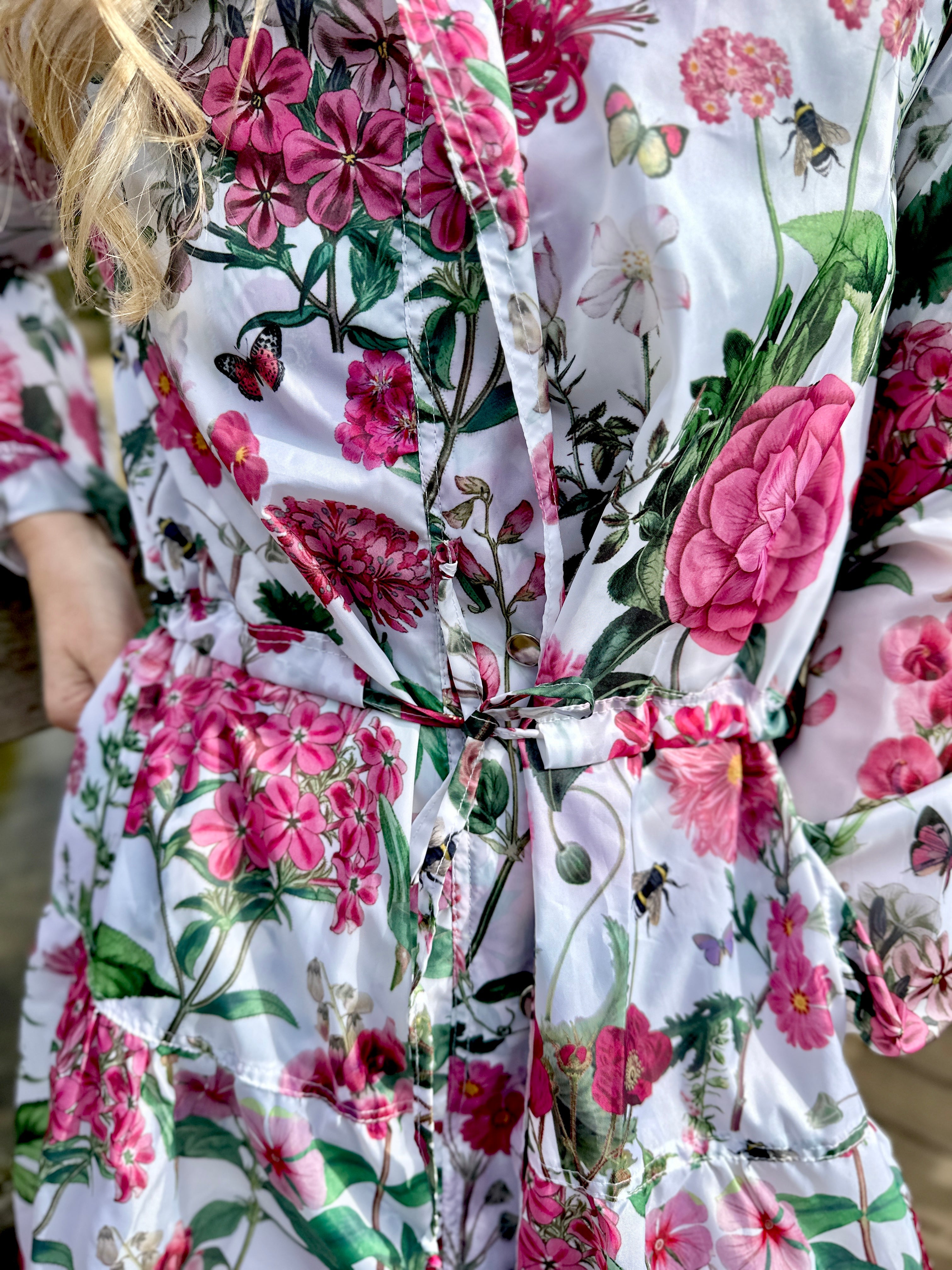 Beautiful light-weight calf length summer parka from Rosehip Design in our vibrant Sweetpeas design. The Windsor Parka has a long tiered skirt, drawstring waist and fully lined hood.