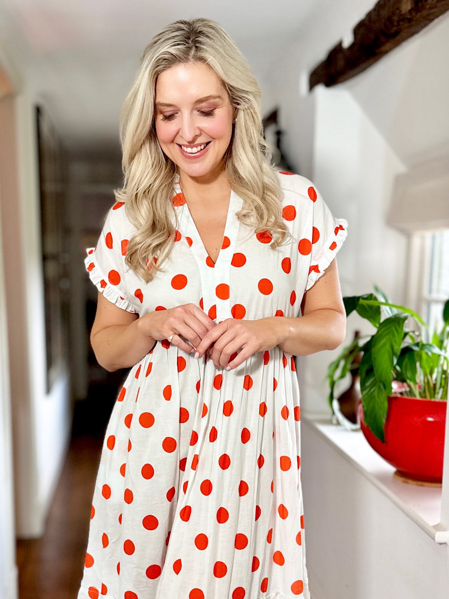 Rosehip Design Olivia is a beautiful cotton dress in our happy and fun Orange Dot print. The Olivia dress has short, capped sleeves with a rough frill. The skirt is tiered and has pockets.