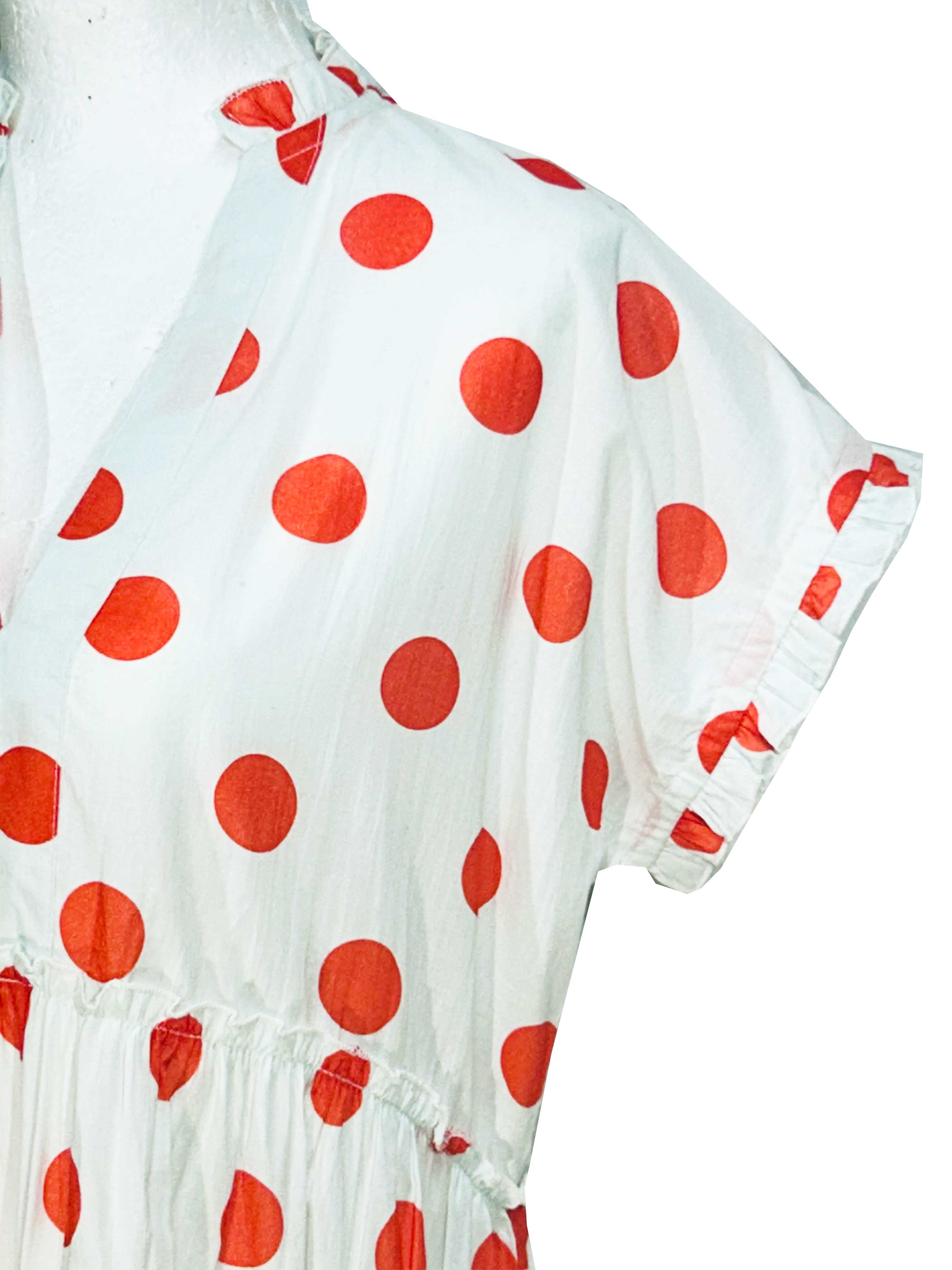 Rosehip Design Olivia is a beautiful cotton dress in our happy and fun Orange Dot print. The Olivia dress has short, capped sleeves with a rough frill. The skirt is tiered and has pockets.