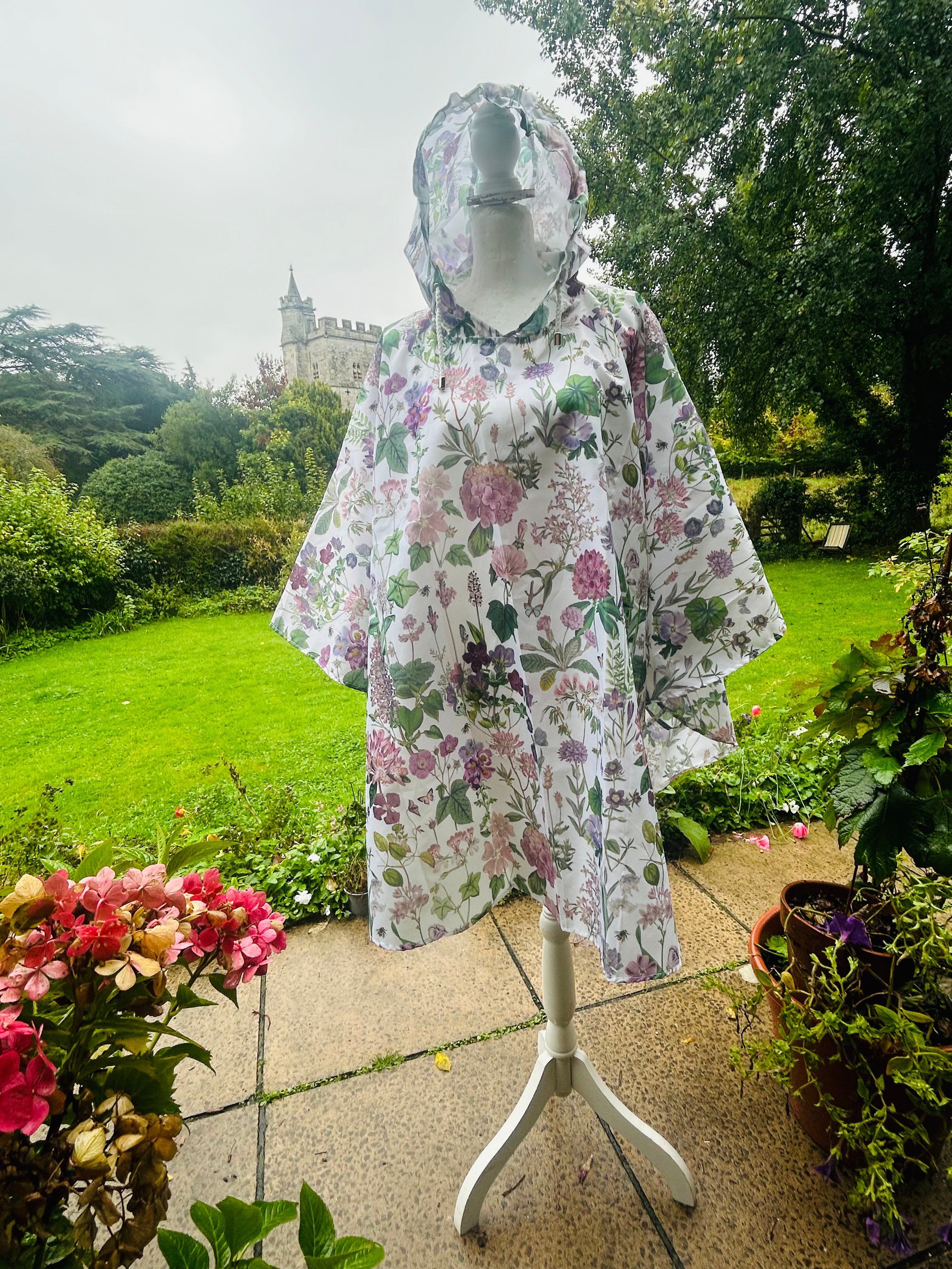 Rosehip Design Rain Poncho is a stylish and practical solution for rainy days, combining fashion with functionality in our stunning Mallow design of pinks, lilacs and greens. Made from lightweight, waterproof material, these ponchos are designed for easy portability, folding neatly into a compact drawstring bags. Ideal for on-the-go use, the Rosehip Rain Poncho ensures you stay dry without sacrificing style.