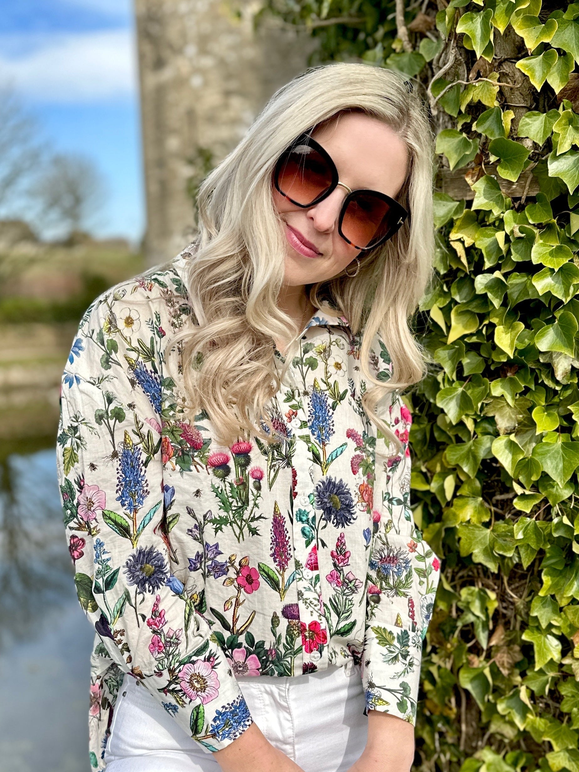 The Rosehip Design Sarah Cotton Shirt is a timeless wardrobe staple, made of soft cotton. It features a classic button-down front, elegant sleeves that end just before the wrist, and a gently curved hem for a relaxed yet polished look.
Featuring our vibrant Barcelona print, this shirt is a celebration of summer, bursting with lively hues and intricate floral patterns. Perfect for warm-weather styling, it pairs beautifully with the matching Sally Skirt for a coordinated ensemble, or just jeans.