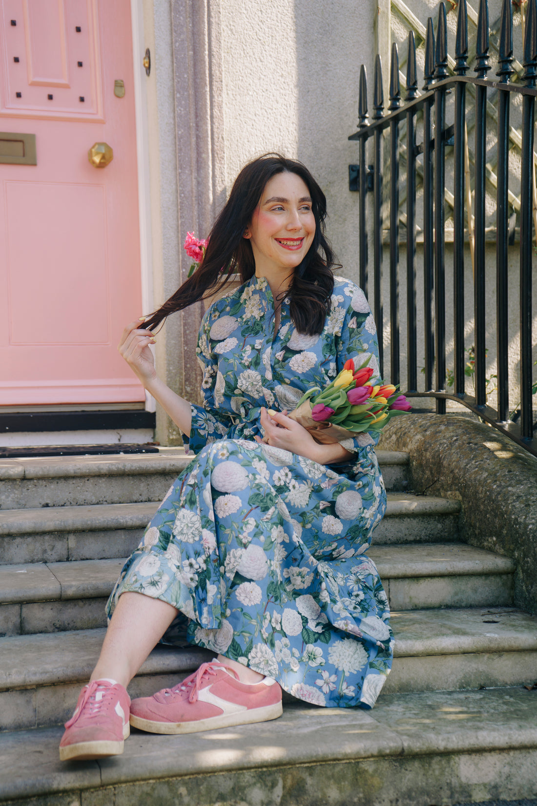 The Ally Cotton Dress in Camelia Periwinkle from Rosehip Design is a versatile wardrobe staple with effortless charm. Featuring a button-down front, handy pockets, and a flattering half-frill hem, it offers both style and comfort. Wear it loose for a relaxed feel or cinch the waist with the tie belt for a more defined silhouette—perfect for any occasion.