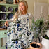 This striking floral apron from Rosehip Design is a stylish and practical choice for cooking or gardening.
The comfortable cotton design features an adjustable neck strap and generous deep pockets for tools.
Durable and machine-washable, it offers full coverage and long-lasting elegance in the kitchen.
Also available in Matching Tea Towels and Heart Pot Holders. 