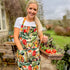 This striking floral apron from Rosehip Design is a stylish and practical choice for cooking or gardening.
The comfortable cotton design features an adjustable neck strap and generous deep pockets for tools.
Durable and machine-washable, it offers full coverage and long-lasting elegance in the kitchen.
Also available in Matching Tea Towels and Heart Pot Holders. 