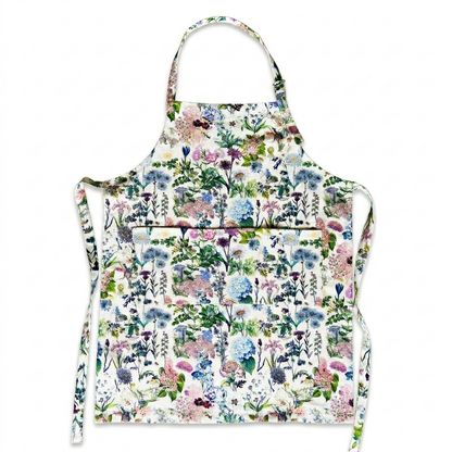 This striking floral apron from Rosehip Design is a stylish and practical choice for cooking or gardening.
The comfortable cotton design features an adjustable neck strap and generous deep pockets for tools.
Durable and machine-washable, it offers full coverage and long-lasting elegance in the kitchen.
Also available in Matching Tea Towels and Heart Pot Holders. 