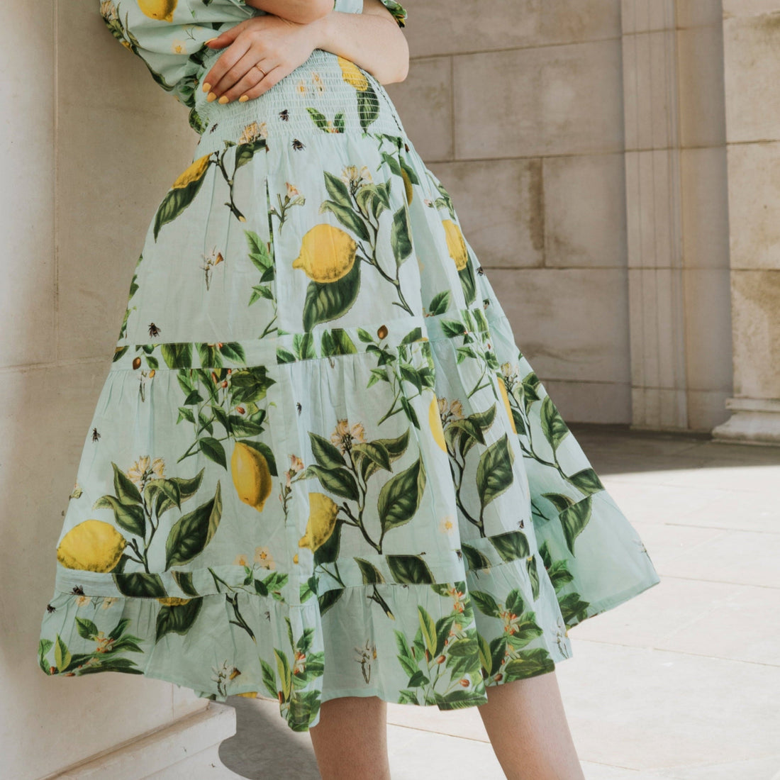 Rosehip Design Bella Cotton Skirt in our delicious Citrus Blue print is a beautifully feminine and effortlessly comfortable piece, perfect for Summer. Made from soft, breathable cotton it features a flattering shirred waistband that provides a flexible, comfortable fit. The tiered design adds movement & a touch of romantic charm, while the addition of practical pockets makes it as functional as it is stylish.
Whether paired with a simple tee or the coordinating Hannah Shirt, the Bella is a versatile staple.