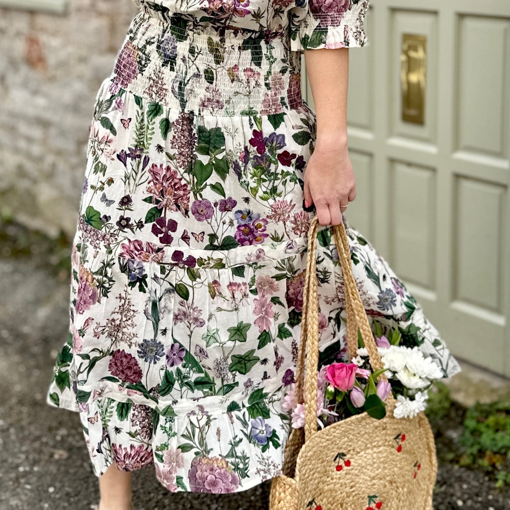 Rosehip Design Bella Cotton Skirt in our ever popular Mallow design is a beautifully feminine and effortlessly comfortable piece, perfect for Summer. Made from soft, breathable cotton it features a flattering shirred waistband that provides a flexible, comfortable fit. The tiered design adds movement &amp; a touch of romantic charm, while the addition of practical pockets makes it as functional as it is stylish.
Whether paired with a simple tee or the coordinating Hannah Shirt, the Bella is a versatile staple.