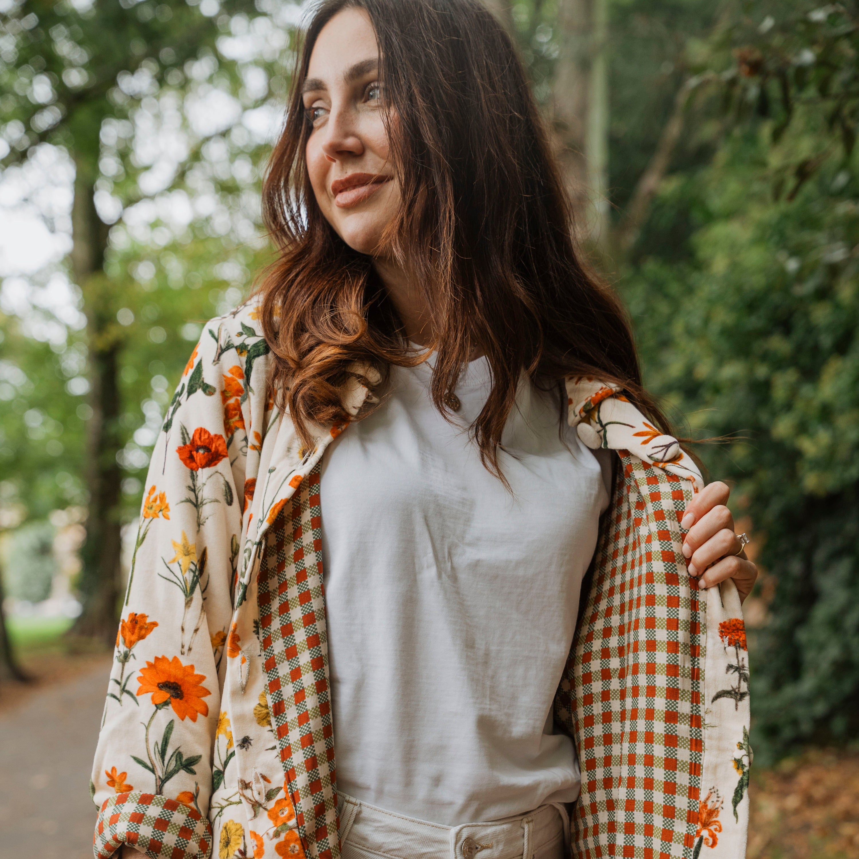 Wrap yourself in effortless elegance with the Rosehip Design Brompton Velvet Coat, designed in a rich velvet fabric that feels as luxurious as it looks. This statement coat features a playful autumn floral print, bringing warmth and charm to your seasonal wardrobe. Fully lined in co-ordinating checks, it offers a refined contrast and a polished finish inside and out.