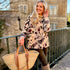 Wrap yourself in effortless elegance with the Rosehip Design Brompton Velvet Coat, designed in a rich velvet fabric that feels as luxurious as it looks. This statement coat features a playful autumn floral print, bringing warmth and charm to your seasonal wardrobe. Fully lined in co-ordinating checks, it offers a refined contrast and a polished finish inside and out.