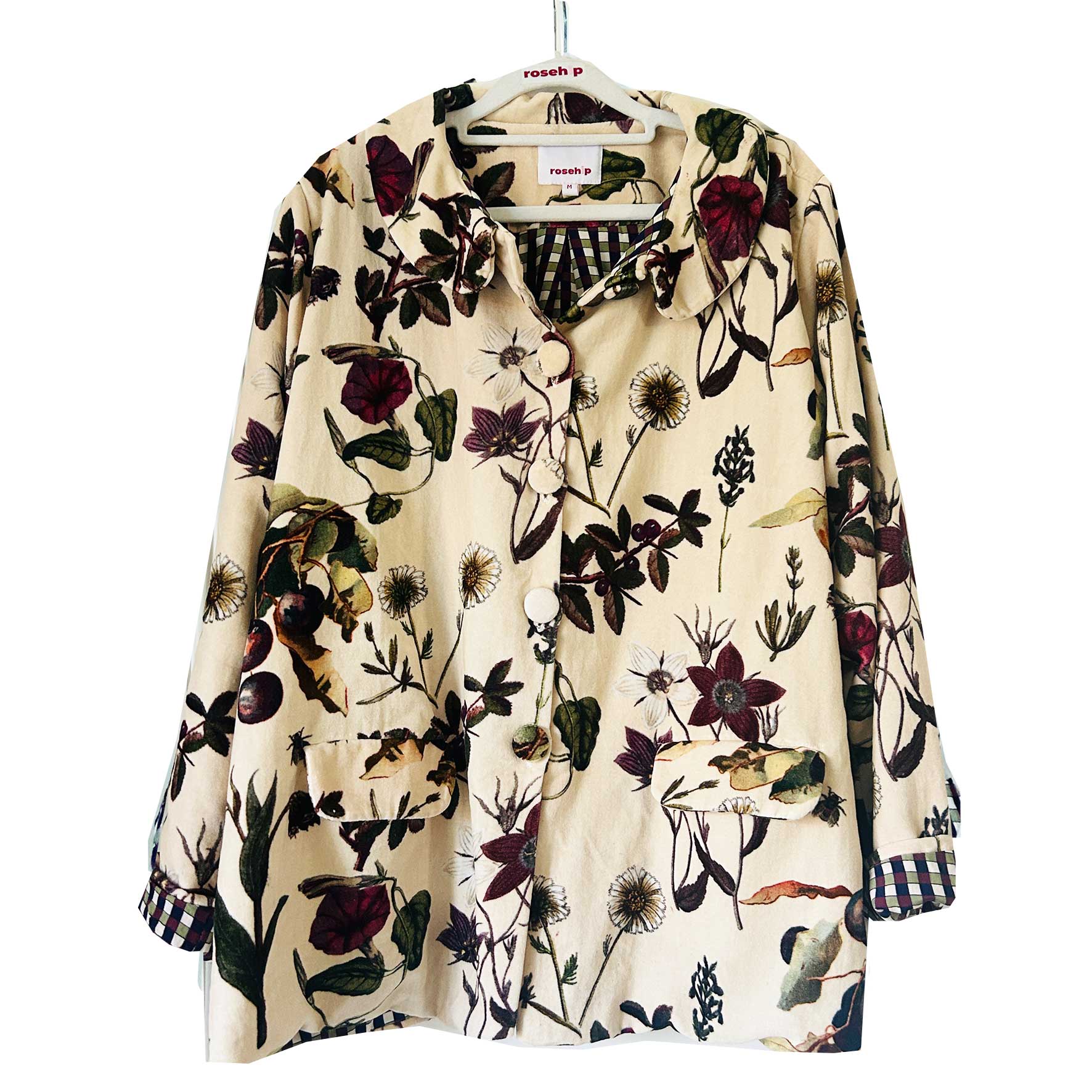 Wrap yourself in effortless elegance with the Rosehip Design Brompton Velvet Coat, designed in a rich velvet fabric that feels as luxurious as it looks. This statement coat features a playful autumn floral print, bringing warmth and charm to your seasonal wardrobe. Fully lined in co-ordinating checks, it offers a refined contrast and a polished finish inside and out.