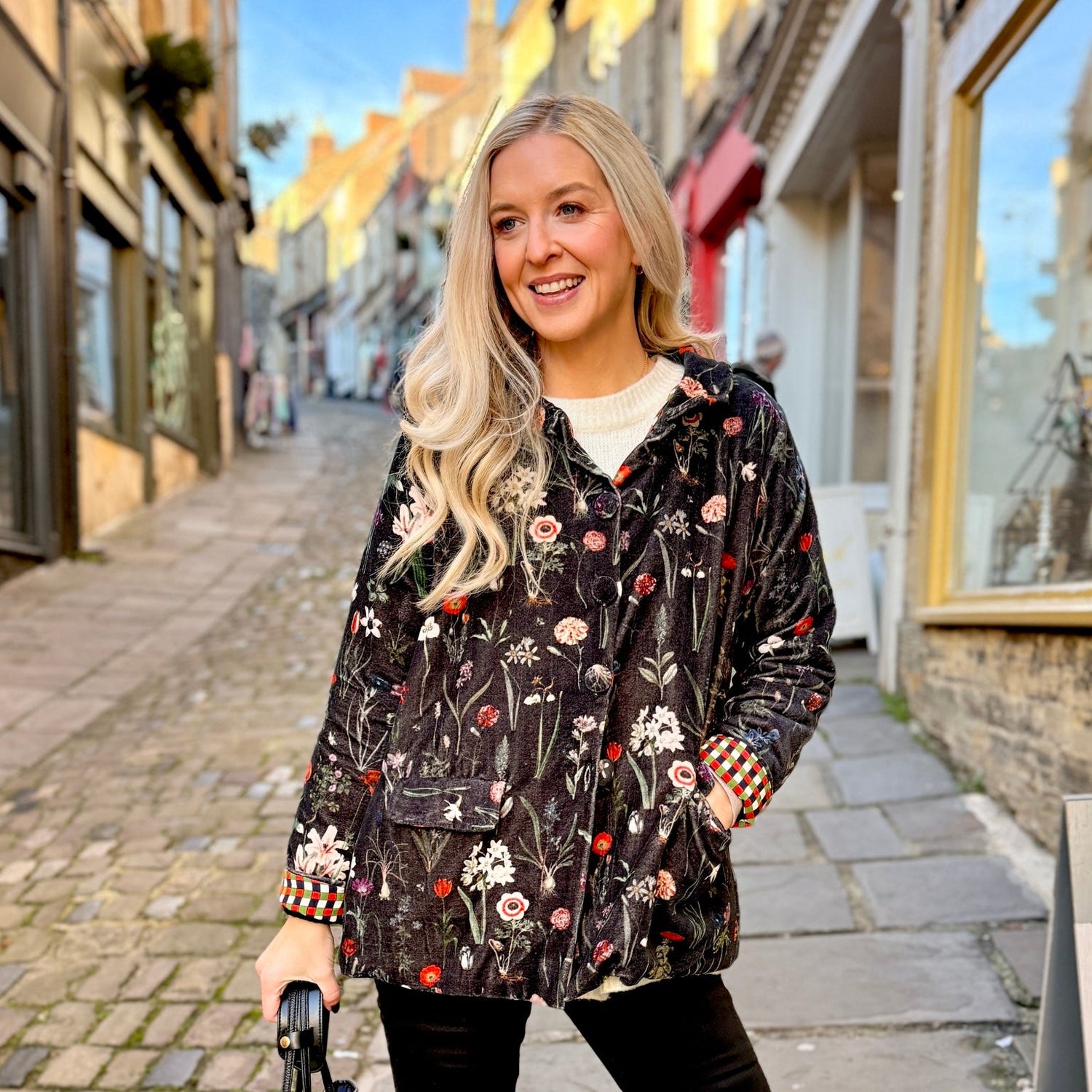 Wrap yourself in effortless elegance with the Rosehip Design Brompton Velvet Coat, designed in a rich velvet fabric that feels as luxurious as it looks. This statement coat features a playful autumn floral print, bringing warmth and charm to your seasonal wardrobe. Fully lined in co-ordinating checks, it offers a refined contrast and a polished finish inside and out.