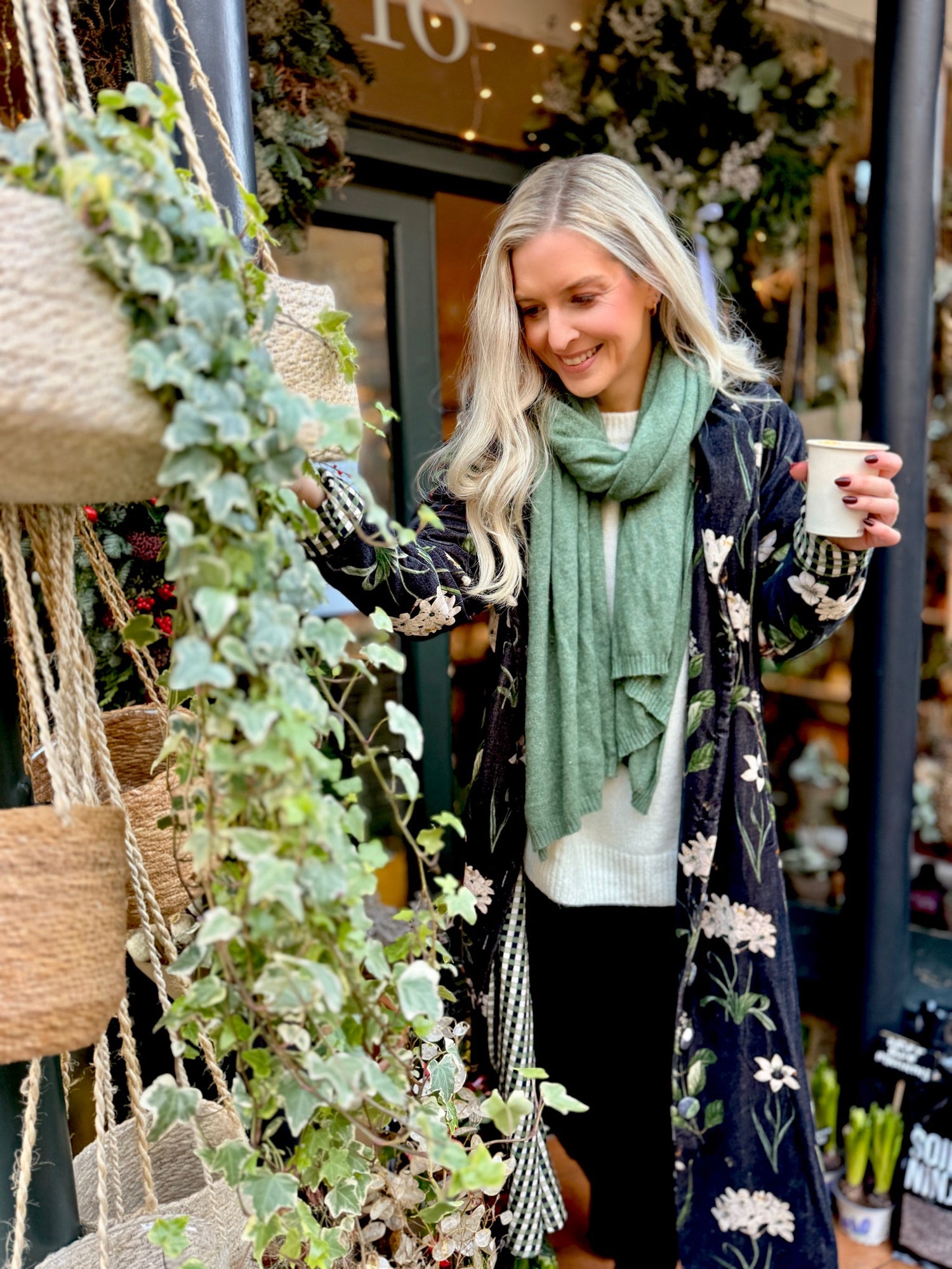 Wrap yourself in autumn warmth with this long velvet coat in a rich Rosehip Design Winter Floral that perfectly echoes the season. The beautiful plum tones on navy blue are perfect for this time of year. The soft velvet exterior is complemented by a classic check lining, adding a touch of style to its bold, modern silhouette. Luxuriously warm yet effortlessly wearable, it’s the perfect layer for crisp autumn days — whether you’re strolling through the countryside or heading into the city.