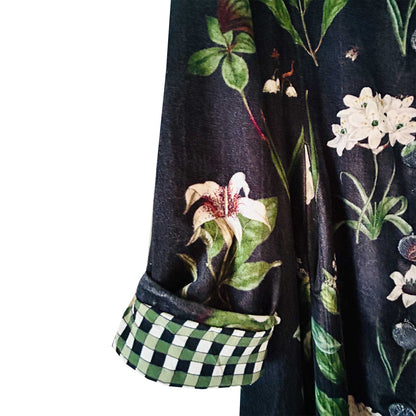 Wrap yourself in autumn warmth with this long velvet coat in a rich Rosehip Design Winter Floral that perfectly echoes the season. The soft velvet exterior is complemented by a classic check lining, adding a touch of style to its bold, modern silhouette. Luxuriously warm yet effortlessly wearable, it’s the perfect layer for crisp autumn days — whether you’re strolling through the countryside or heading into the city.