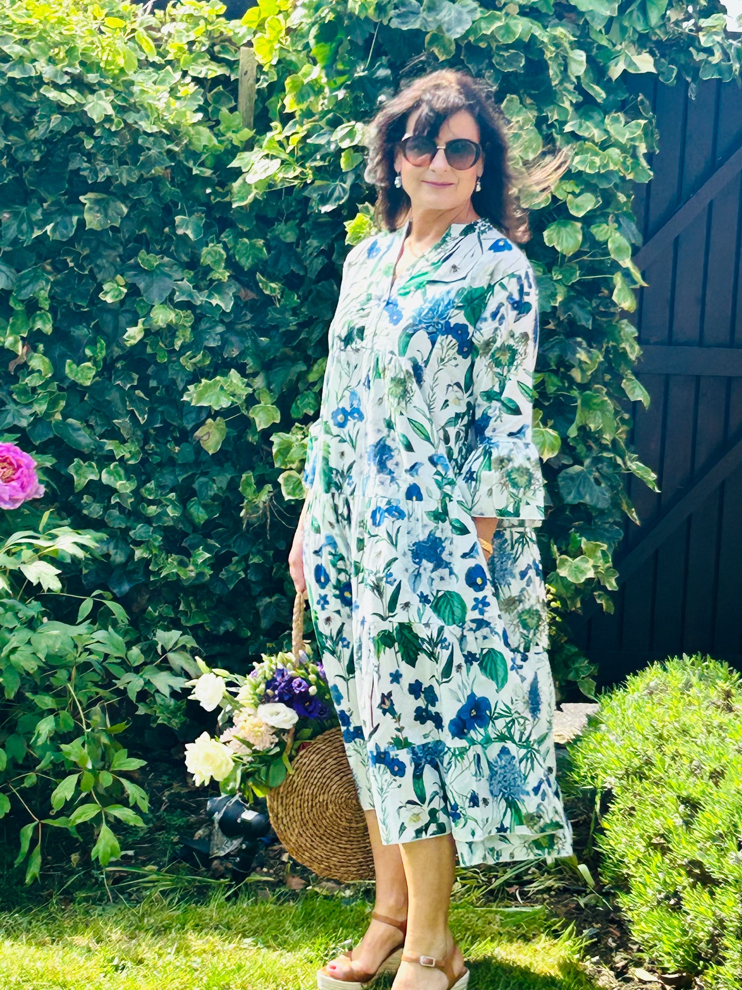 Rosehip Design Chloe Dress in Cobalt is a classic summer floral tiered dress in hues of blues with lovely long angel sleeves and side pockets, made from 100% soft Indian Cotton, packed in a matching bag.