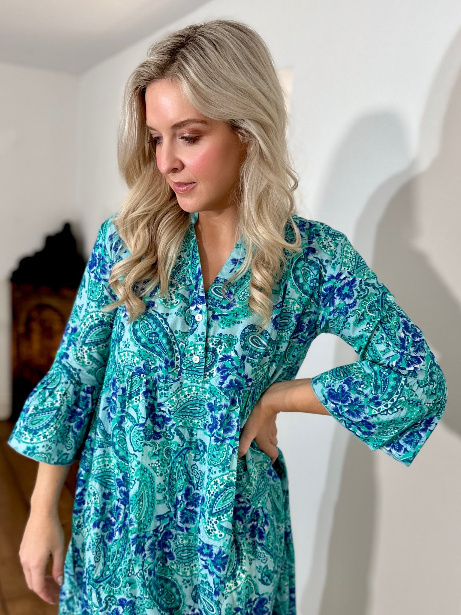 Rosehip Design Chloe Dress in Paisley Seagreen is a classic summer floral tiered dress printed in a fun design featuring the colours of the ocean with lovely long angel sleeves and side pockets, made from 100% soft Indian Cotton, packed in a matching bag.