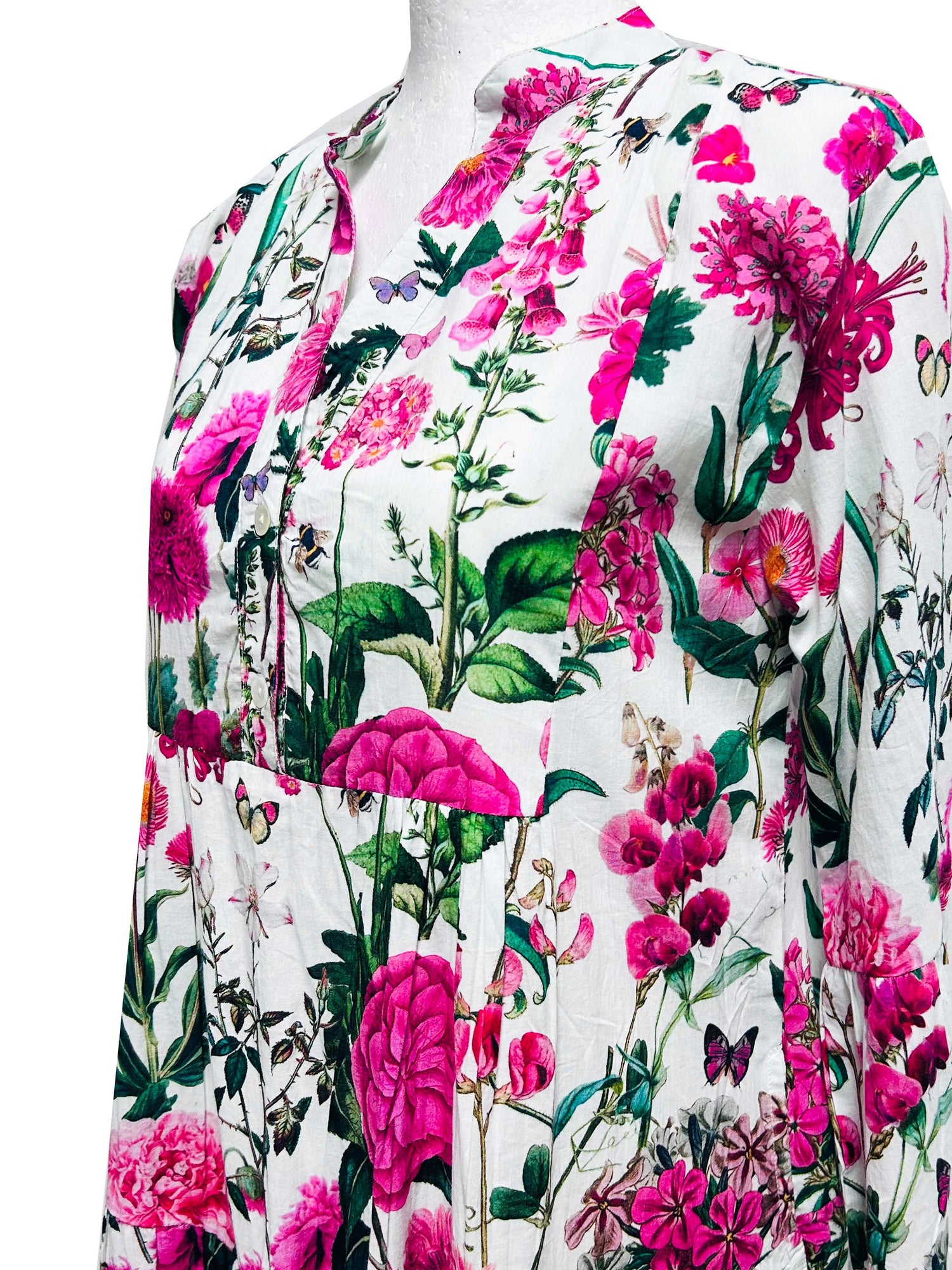 Rosehip Design Chloe Dress in Sweetpeas is a classic summer floral tiered dress printed in a vibrant mix of pinks, greens and reds with lovely long angel sleeves and side pockets, made from 100% soft Indian Cotton, packed in a matching bag.