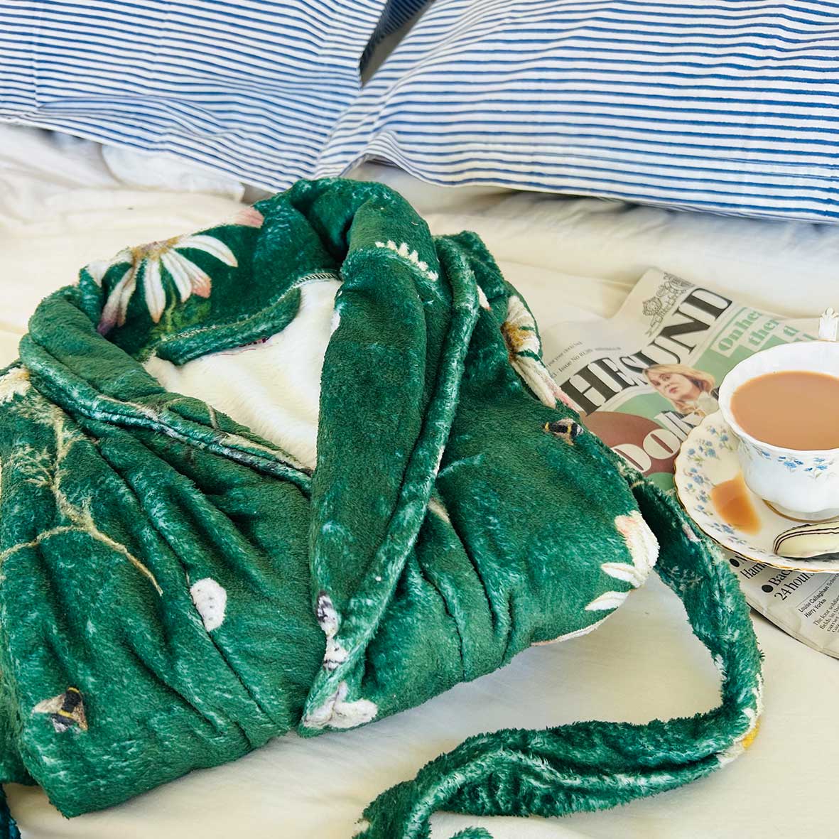 Rosehip Design Fleece Dressing Gown, the epitome of warmth and style for cozy winter evenings. A sumptuously soft dressing gown, designed to envelop you in a gentle embrace, offering a luxurious feel that is perfect for chilly nights. Crafted from high-quality fleece, this gown is not only exceptionally soft but also provides unparalleled comfort. The Heavenly Green design adds a touch of elegance with its delicate floral pattern, bringing a hint of nature&