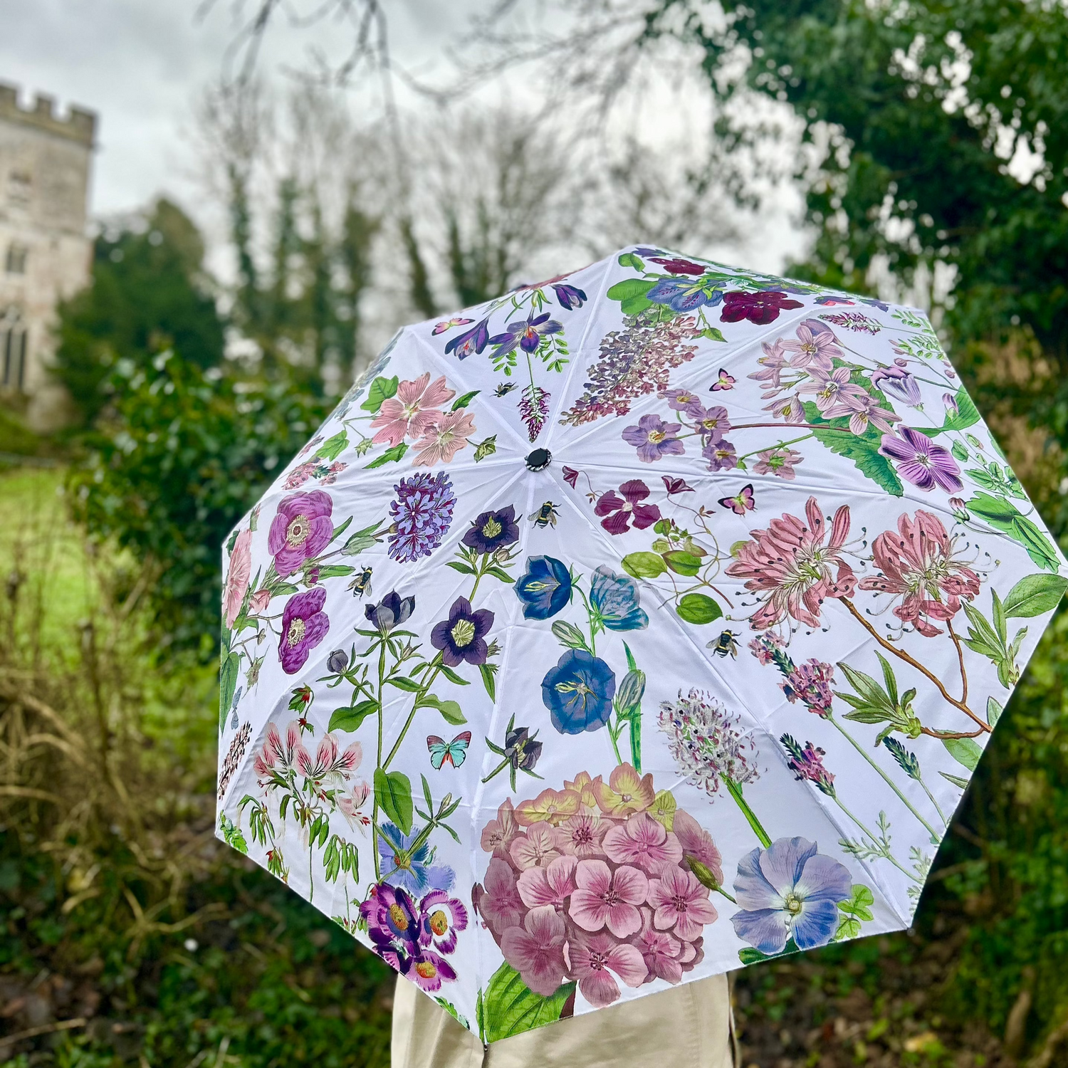 Rosehip Design Folding Umbrella is a sturdy, practical and waterproof rain umbrella with an auto pop-up button, perfectly sized for your car, bag or pocket. Our stunning Mallow design of pinks, lilacs and green will bring a hint of happiness to the dreariest of days.