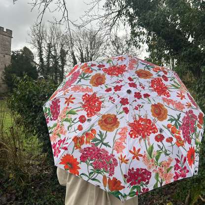 Rosehip Design Folding Umbrella is a sturdy, practical and waterproof rain umbrella with an auto pop-up button, perfectly sized for your car, bag or pocket. Make a statement with our bold Radiance design and it&