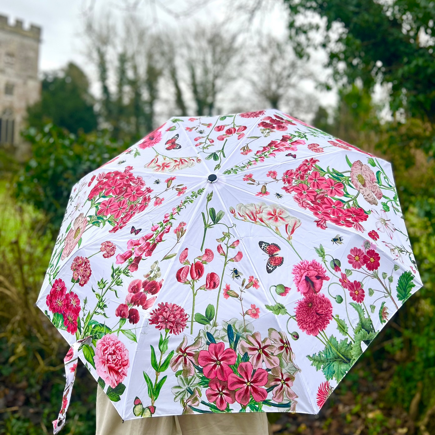 Rosehip Design Folding Umbrella is a sturdy, practical and waterproof rain umbrella with an auto pop-up button, perfectly sized for your car, bag or pocket. Beat the blues with our Sweet Peas design - a vibrant mix of pinks, greens and reds.