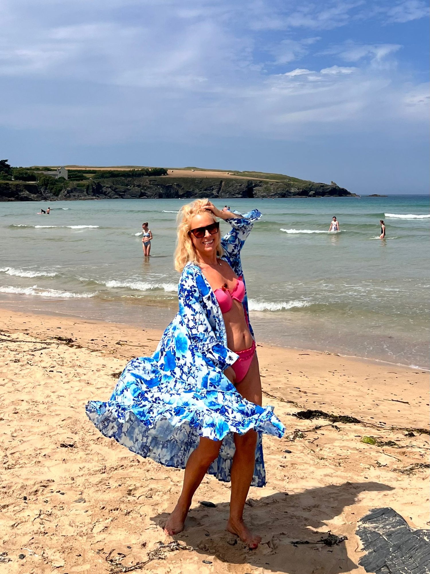 Rosehip Design Gabriella Dress is a glorious Summer Dress made of from 100% soft Indian cotton with lovely feminine detail. It features a dropped waist, rough edge drills between tiers and on the sleeve. In the subtle Blue Rose design it makes a fabulous summer party dress.