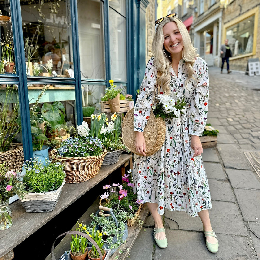 Easy, breezy and beautifully floral – the Rosehip Design Georgie Dress is made from soft, breathable cotton and designed with sunny days in mind. Featuring our delightful April design - a fresh summery floral print, it has a relaxed tiered skirt, charming button-through front, and a detachable tie belt to style it your way. Wear it loose for an effortlessly laid-back look, or cinch it in for a more defined shape. Perfect for garden parties, picnics or simply soaking up the sunshine.