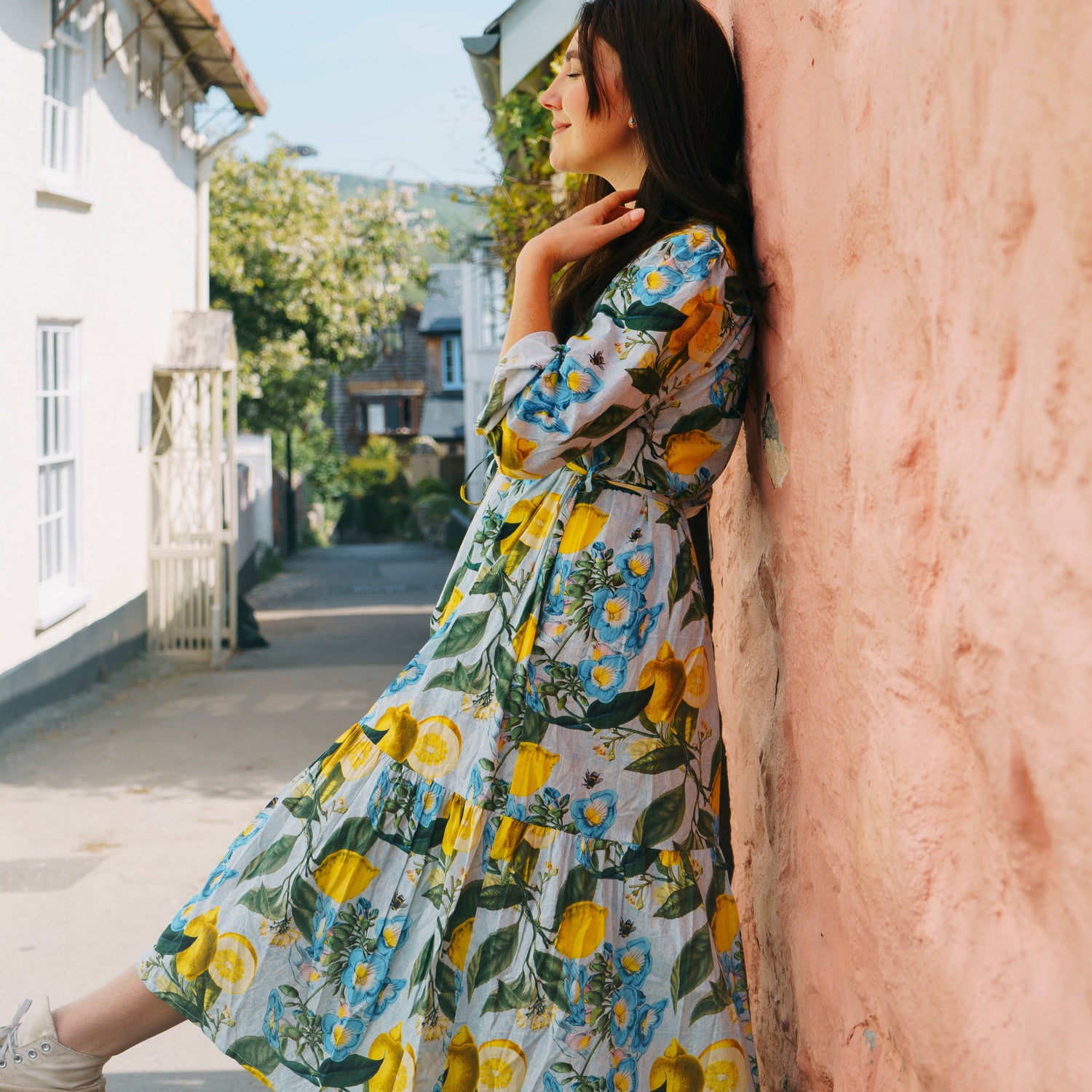 Easy, breezy and beautifully floral – the Georgie Dress fm Rosehip Design is made from soft, breathable cotton and designed with sunny days in mind. Featuring our Sicily design - a fresh summery floral print, it has a relaxed tiered skirt, charming button-through front, and a detachable tie belt to style it your way. Wear it loose for an effortlessly laid-back look, or cinch it in for a more defined shape. Perfect for garden parties, picnics or simply soaking up the sunshine.