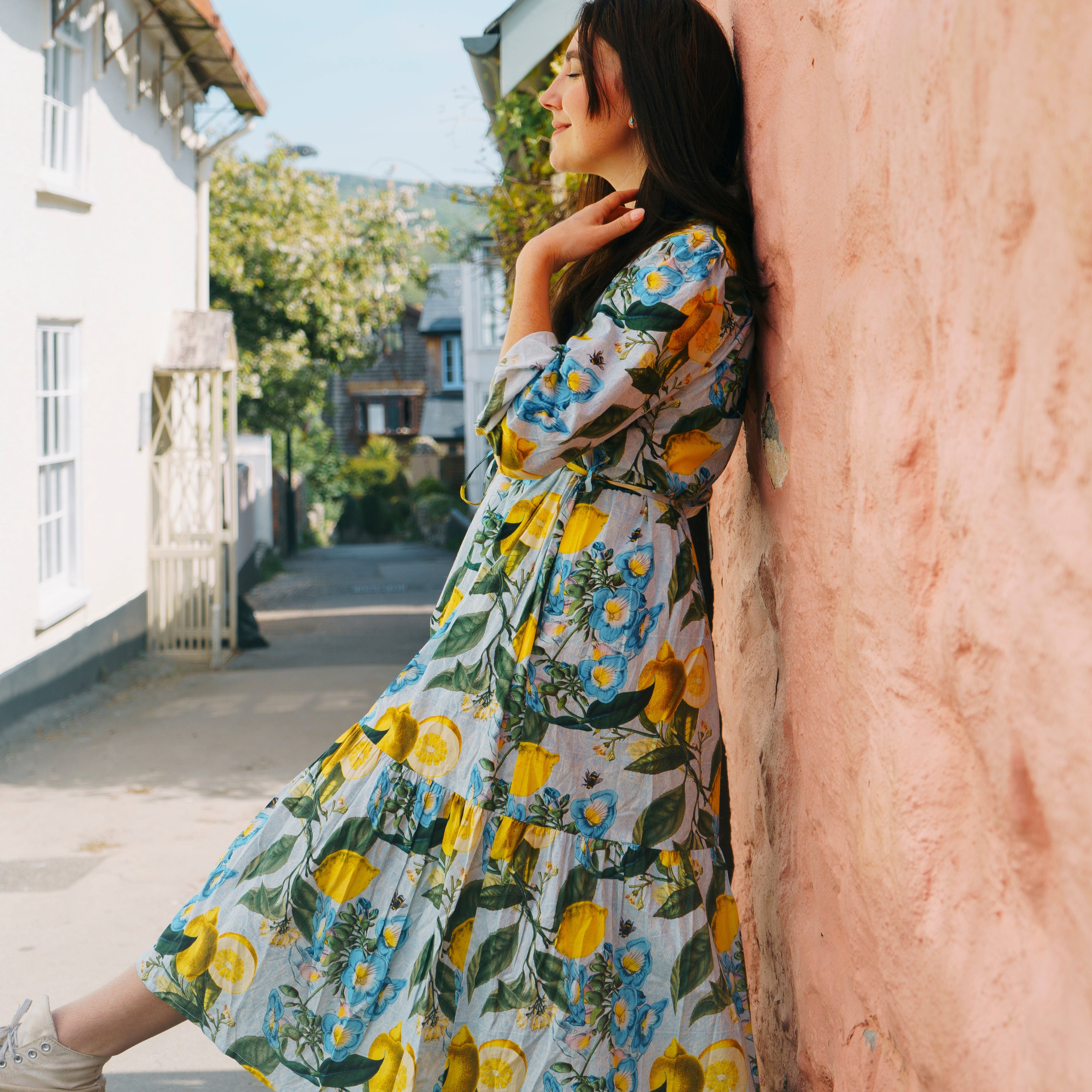 Easy, breezy and beautifully floral – the Georgie Dress fm Rosehip Design is made from soft, breathable cotton and designed with sunny days in mind. Featuring our Sicily design - a fresh summery floral print, it has a relaxed tiered skirt, charming button-through front, and a detachable tie belt to style it your way. Wear it loose for an effortlessly laid-back look, or cinch it in for a more defined shape. Perfect for garden parties, picnics or simply soaking up the sunshine.