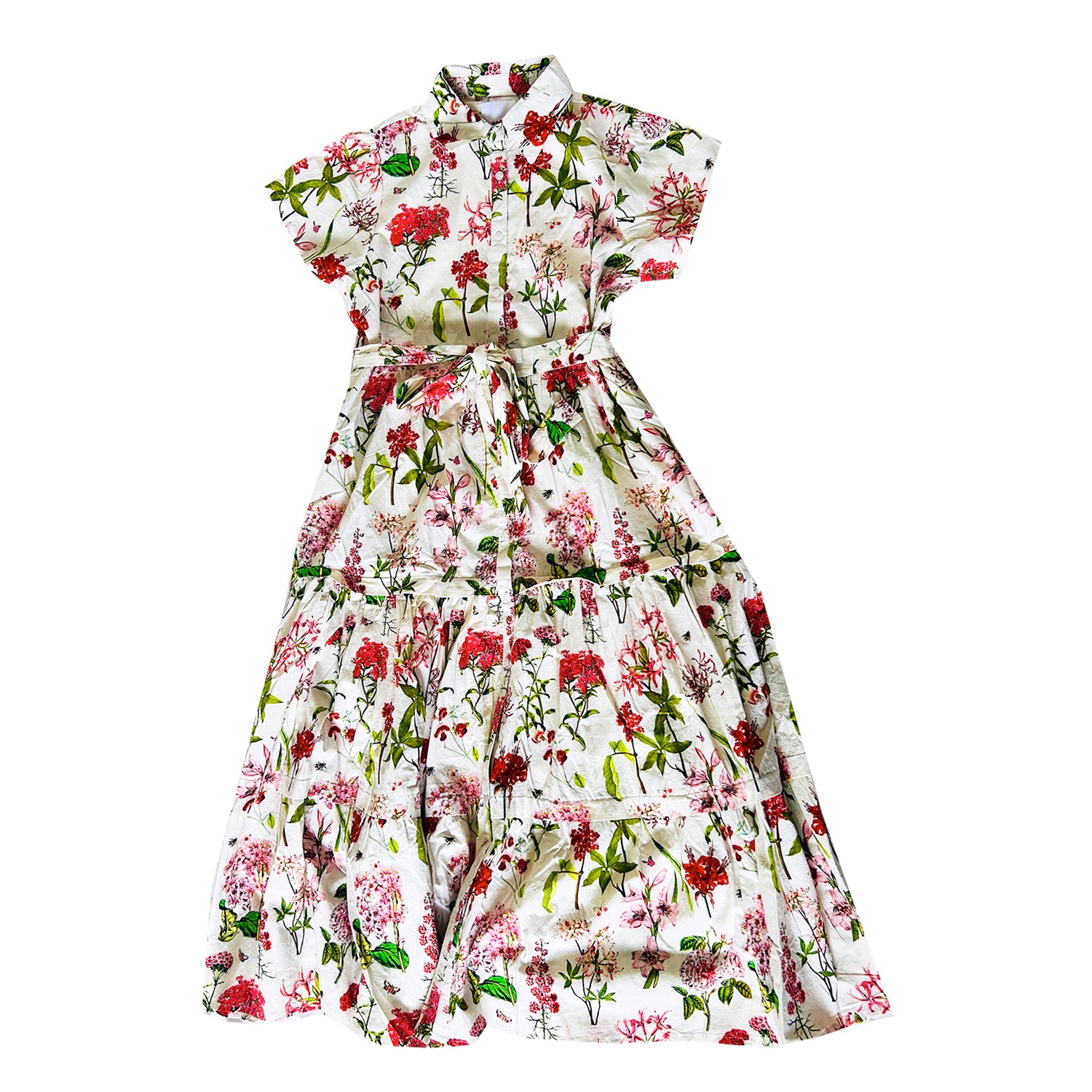 Rosehip Design Grace is a maxi dress made of Cotton Poplin. The Grace dress has buttons down the front, a tuck between tiers, short sleeves, and of course, side pockets.