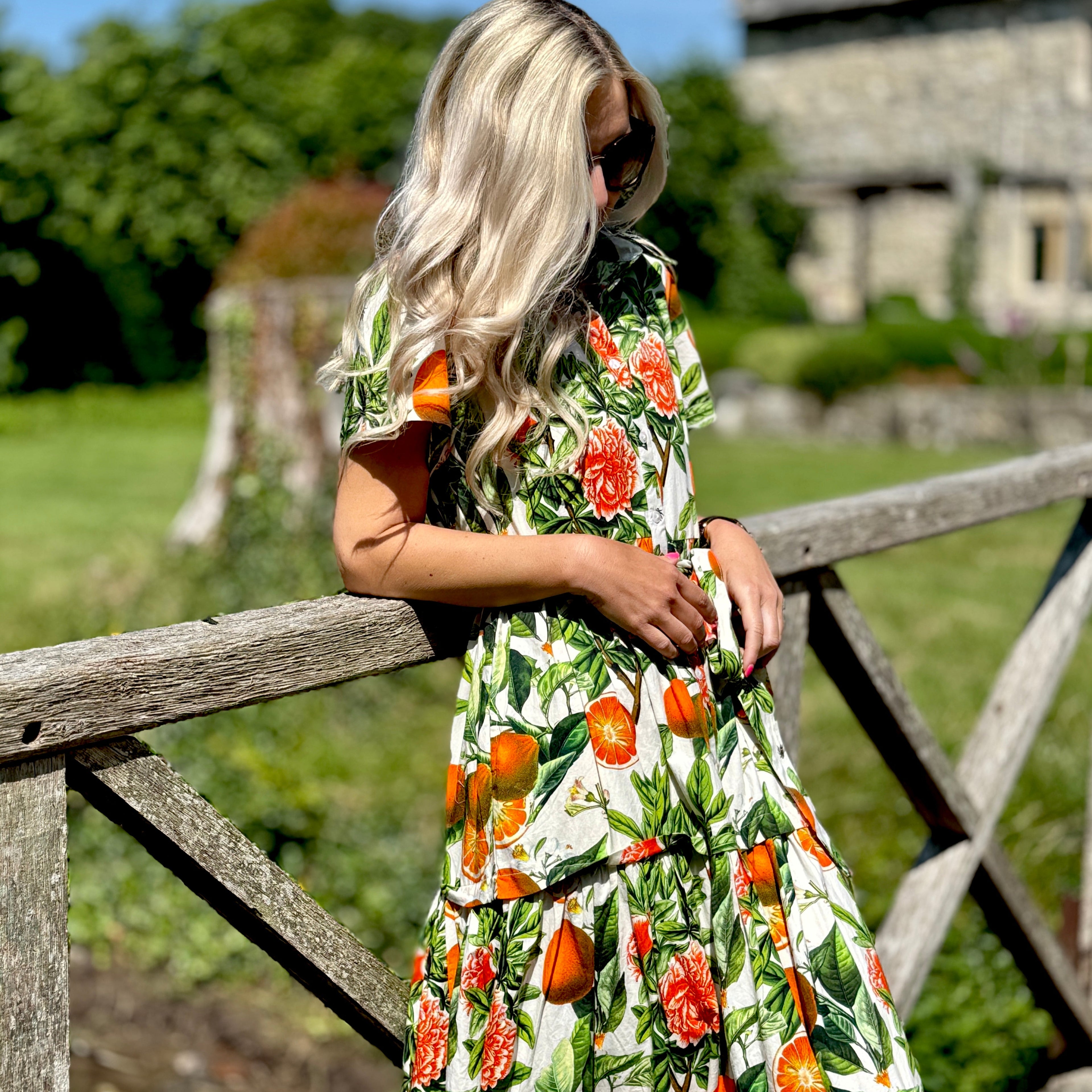 The Rosehip Design Grace Cotton Dress is a maxi style dress made of 100% Cotton Poplin.

Stylishly designed with buttons down the front, a tuck between tiers, short sleeves, and of course, side pockets.
