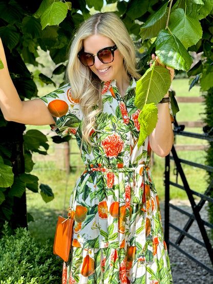 The Rosehip Design Grace Cotton Dress is a maxi style dress made of 100% Cotton Poplin.

Stylishly designed with buttons down the front, a tuck between tiers, short sleeves, and of course, side pockets.
