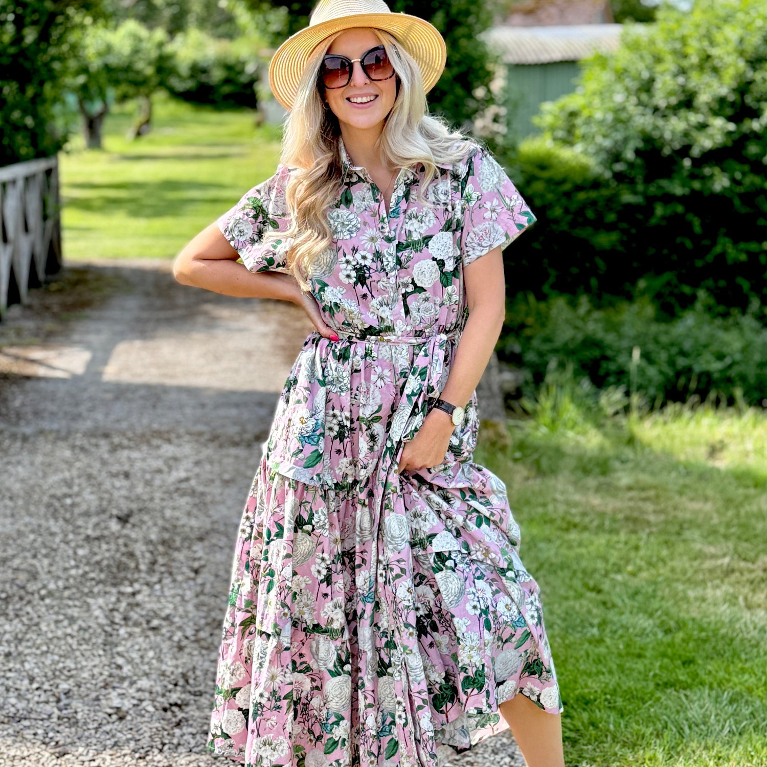 The Rosehip Design Grace Cotton Dress is a maxi style dress made of 100% Cotton Poplin.

Stylishly designed with buttons down the front, a tuck between tiers, short sleeves, and of course, side pockets.
