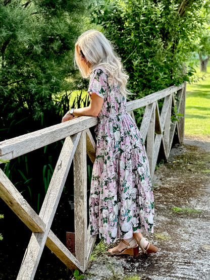 The Rosehip Design Grace Cotton Dress is a maxi style dress made of 100% Cotton Poplin.

Stylishly designed with buttons down the front, a tuck between tiers, short sleeves, and of course, side pockets.

