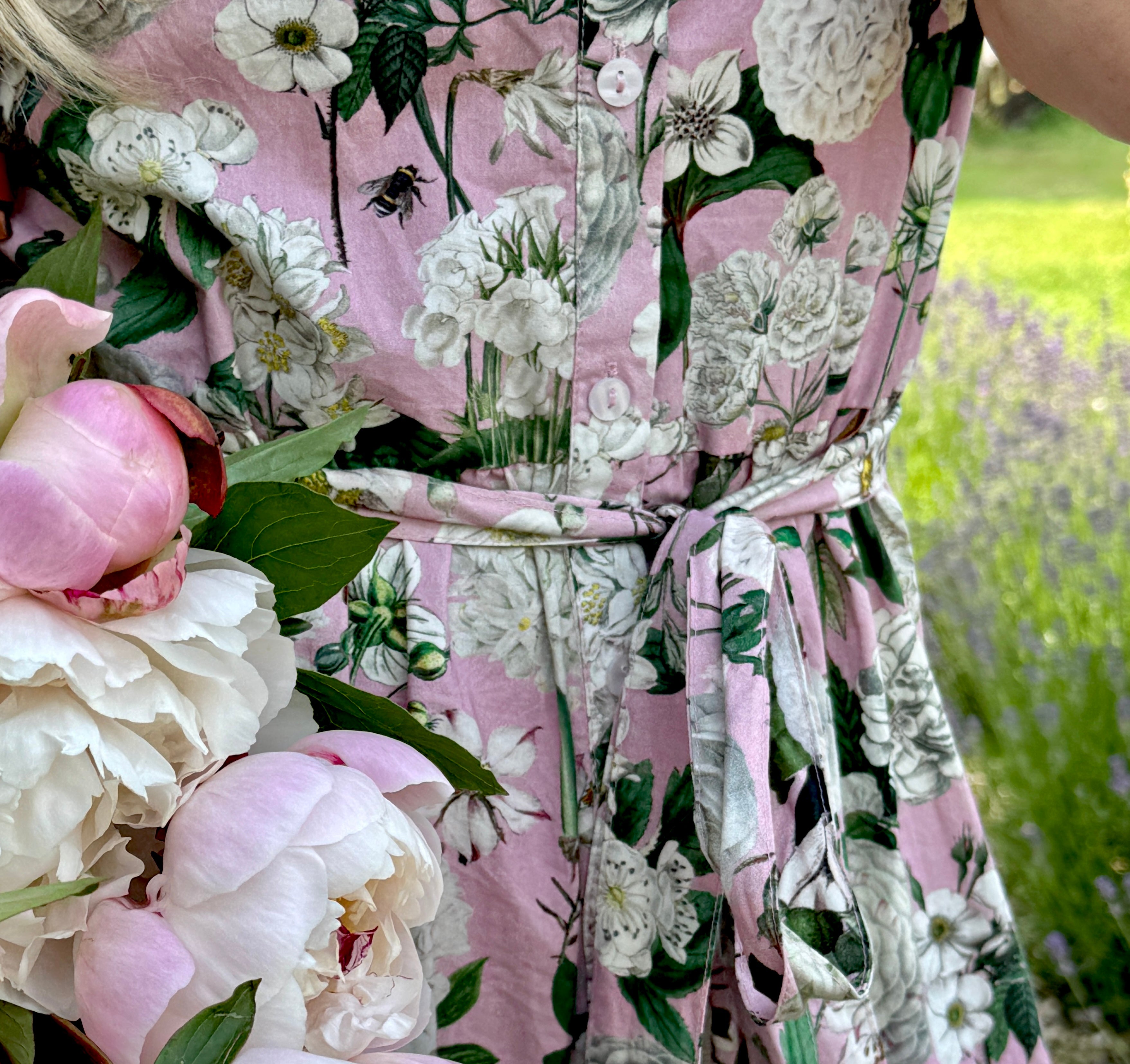 The Rosehip Design Grace Cotton Dress is a maxi style dress made of 100% Cotton Poplin.

Stylishly designed with buttons down the front, a tuck between tiers, short sleeves, and of course, side pockets.
